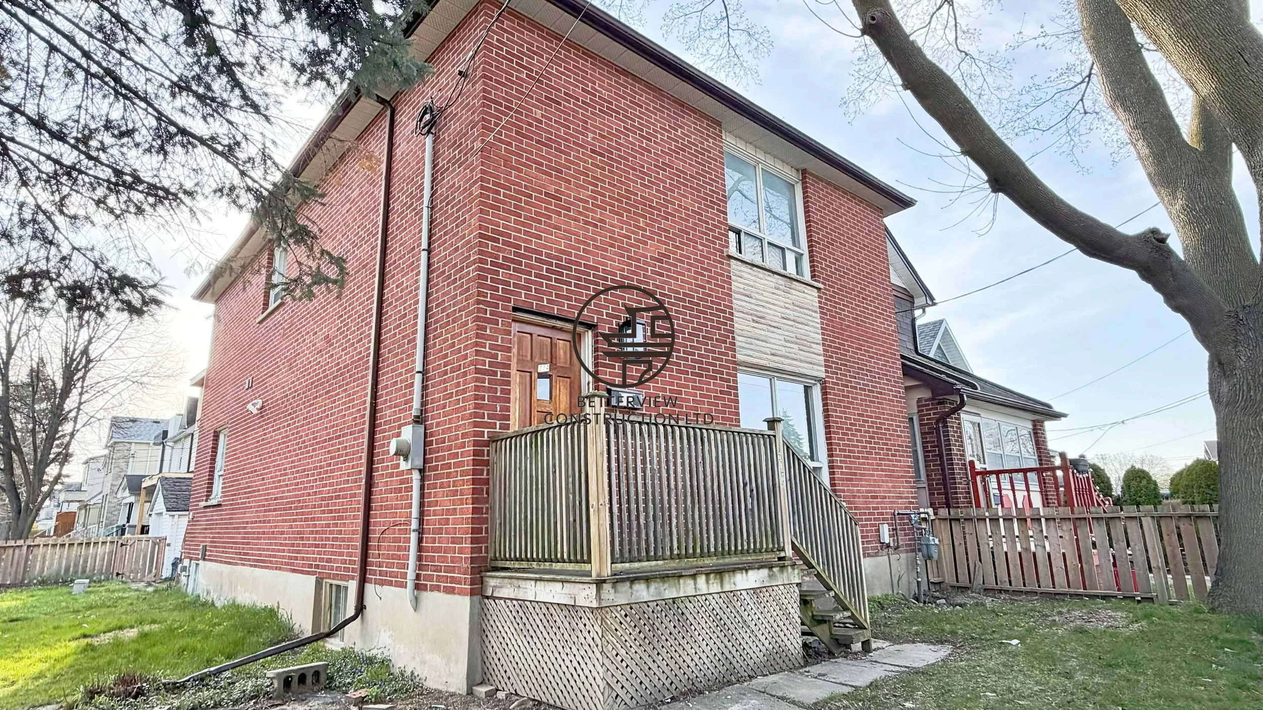 Exterior view of the property showcasing the completed renovation project by Betterview Construction Ltd. while highlighting the home’s overall structure and surroundings.
