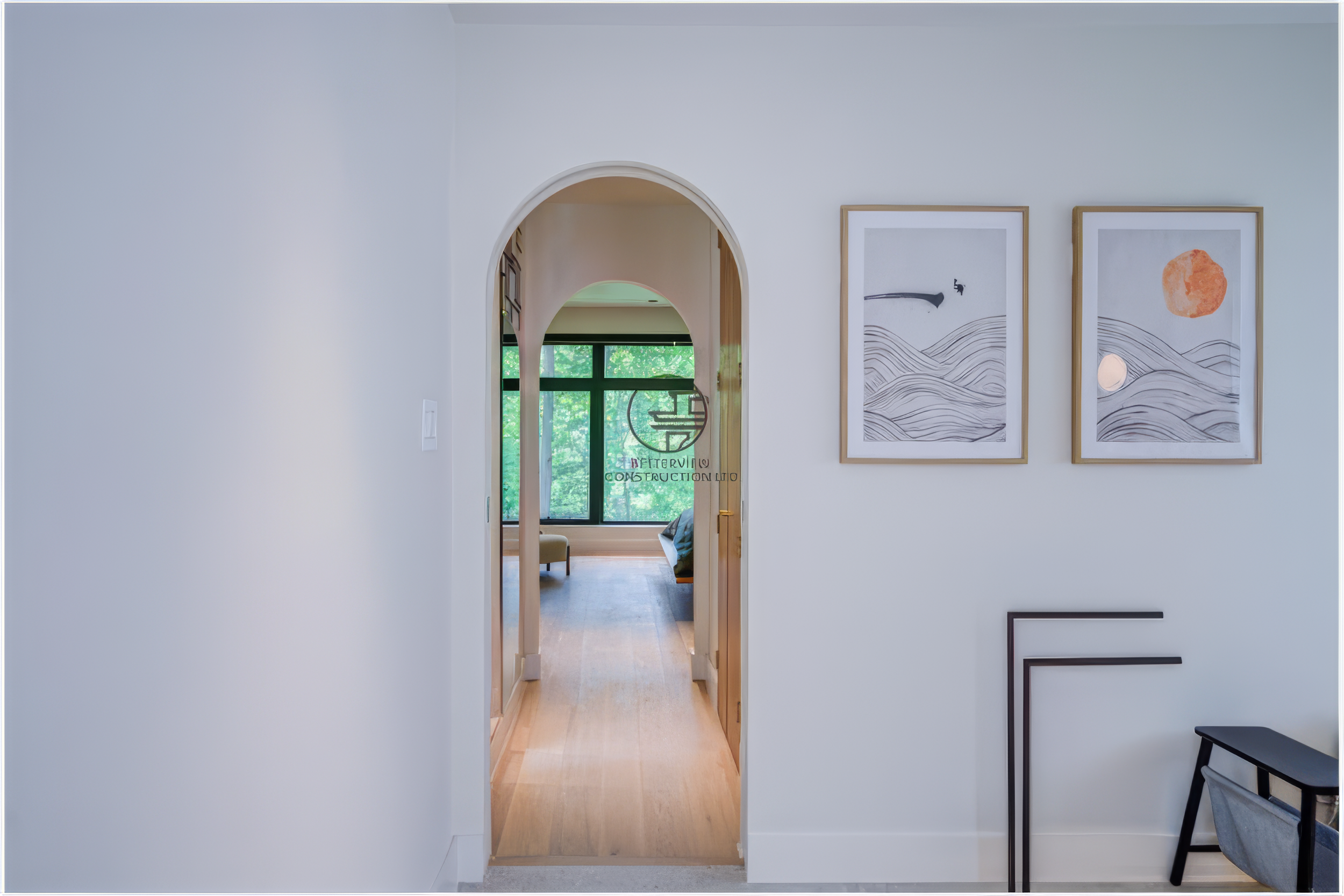 modern arched doorway connecting bathroom and bedroom in renovated home