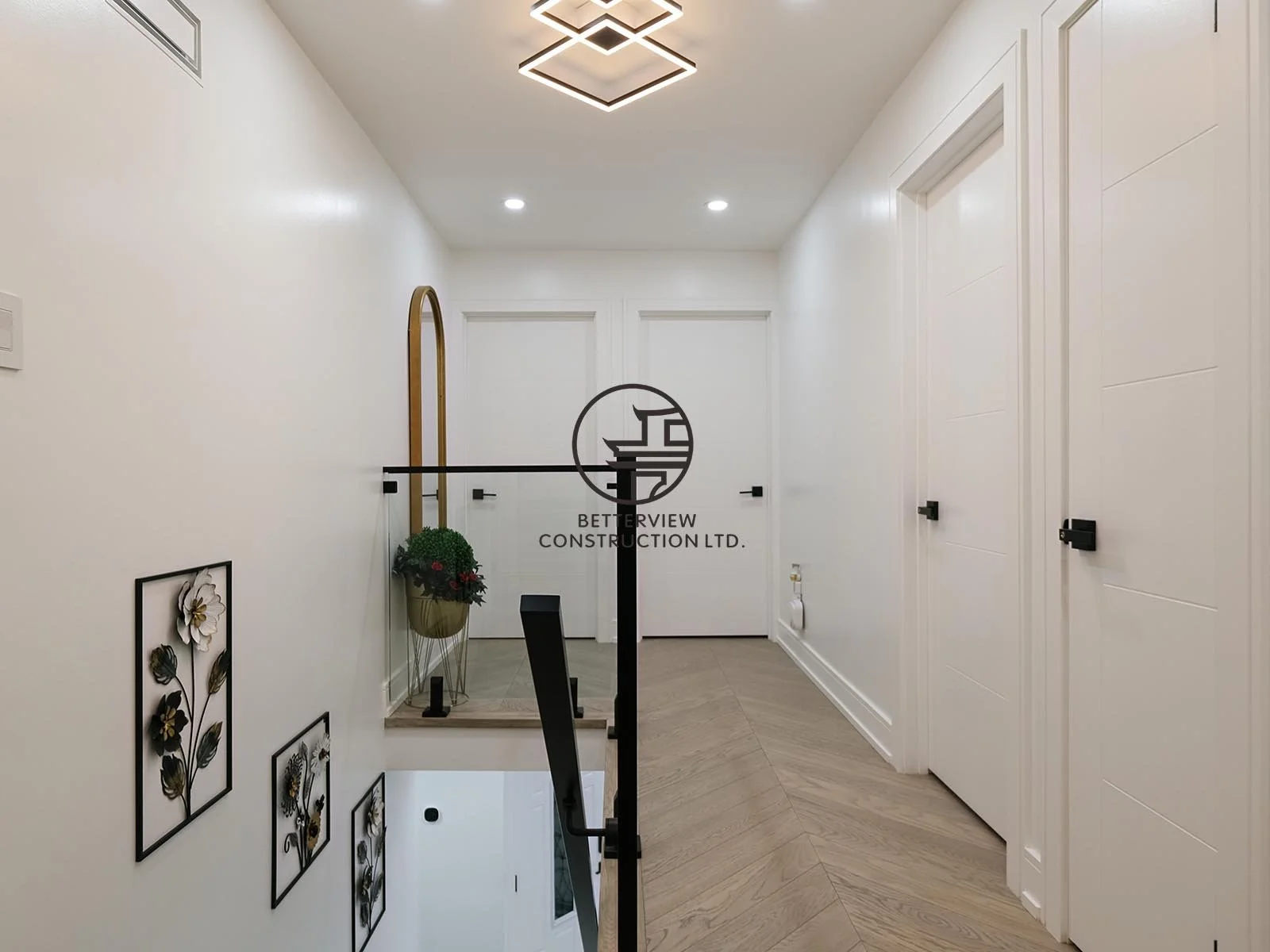 The second-floor hallway features clean architectural lines, modern lighting, and elegant finishes that create a bright and seamless transition between living spaces.