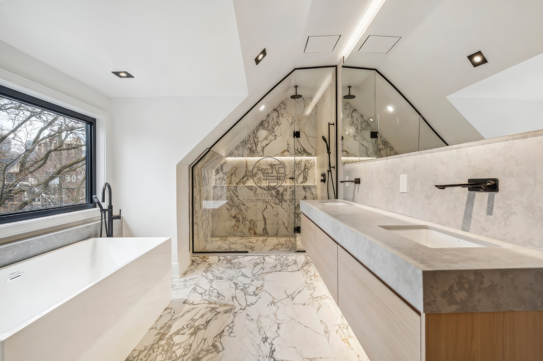 Luxury bathroom with double vanity, freestanding bathtub, marble tile flooring, glass shower enclosure, and skylight ceiling in a modern home renovation project