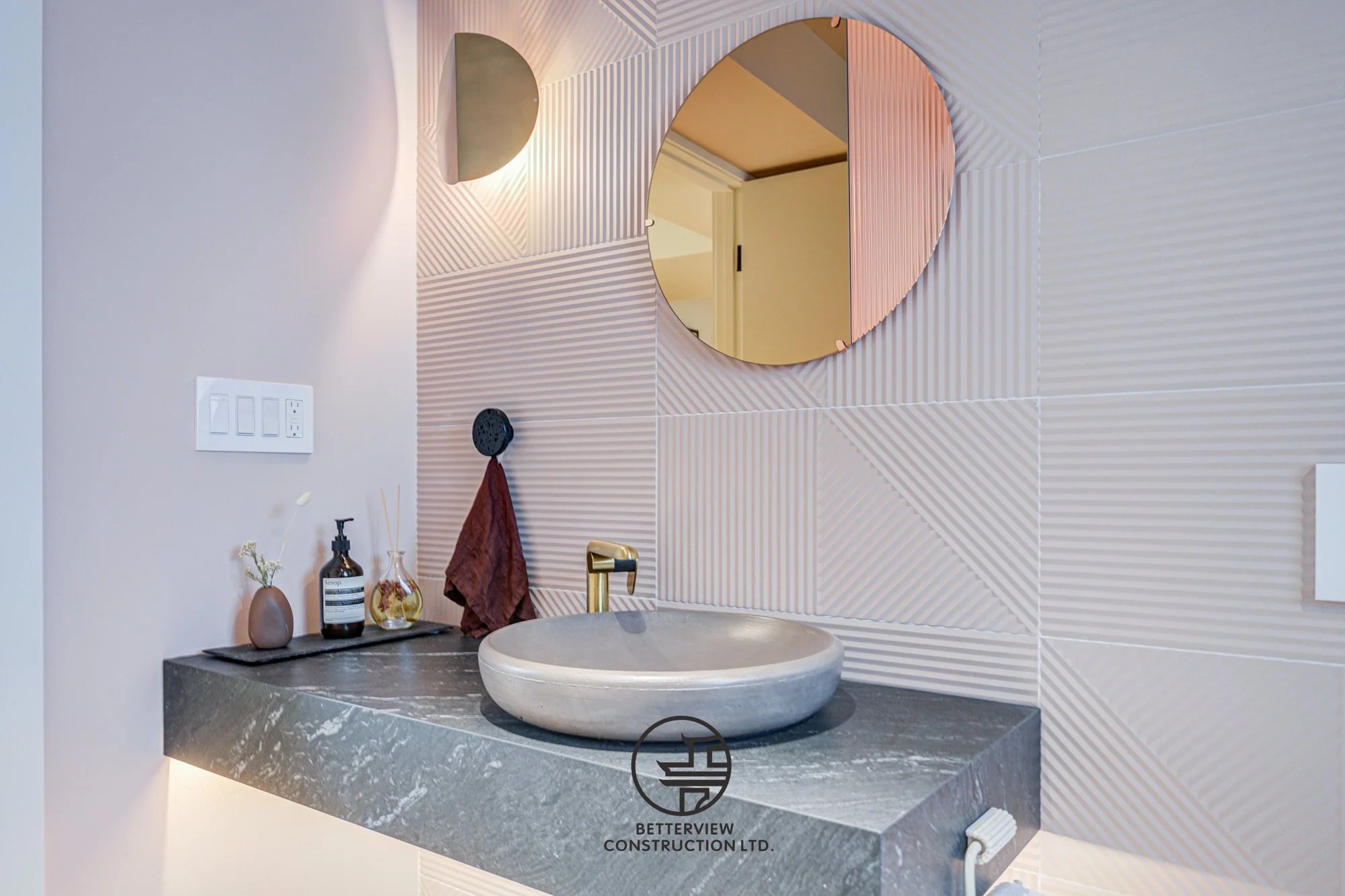 modern bathroom vanity with vessel sink and round mirror