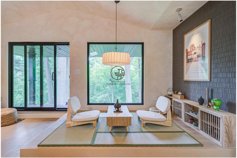 Modern dining and lounge area renovation featuring custom wood furniture, floor-to-ceiling windows, natural light, and minimalist interior design in a GTA home
