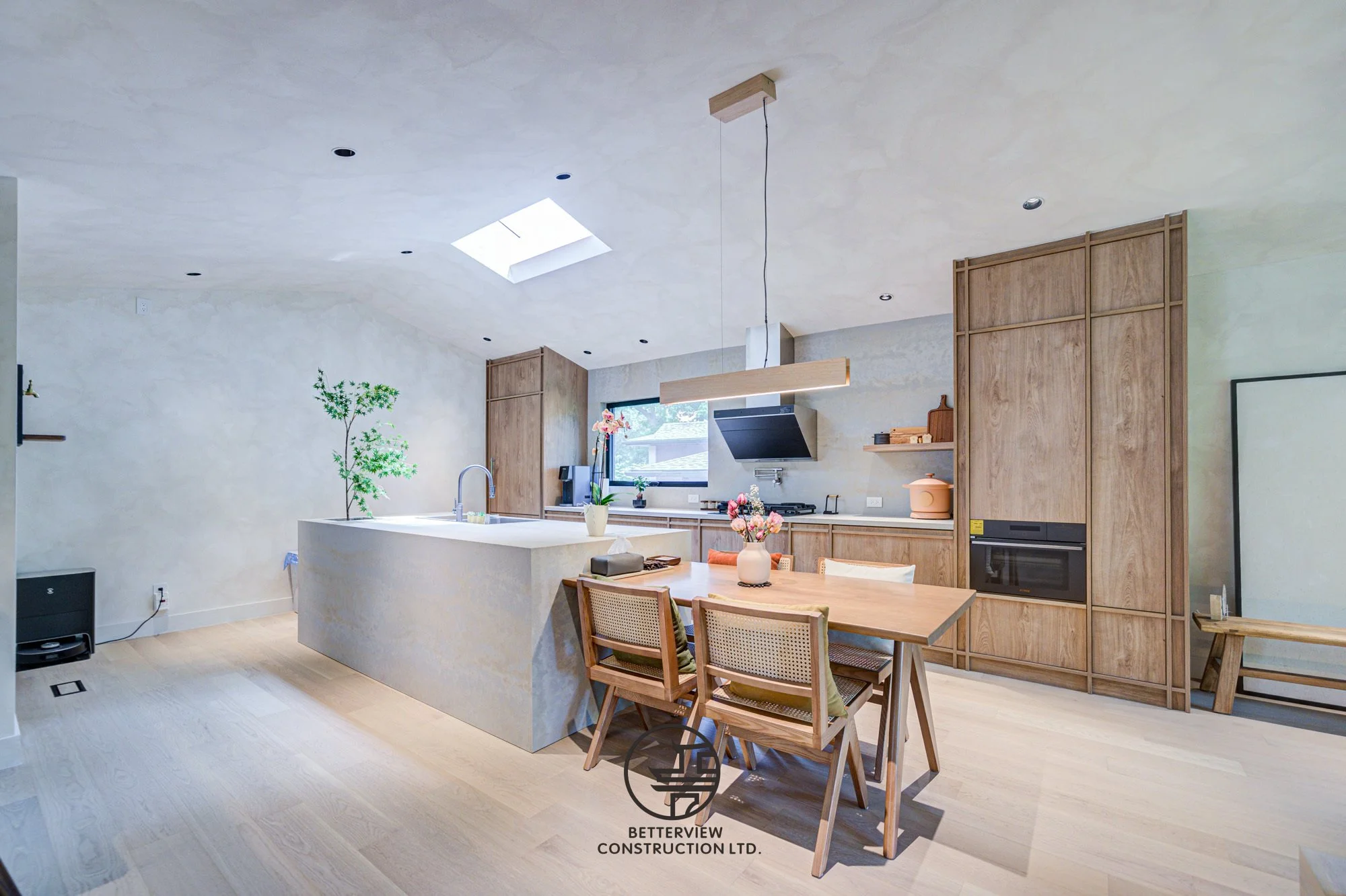 modern open concept kitchen with island and dining area