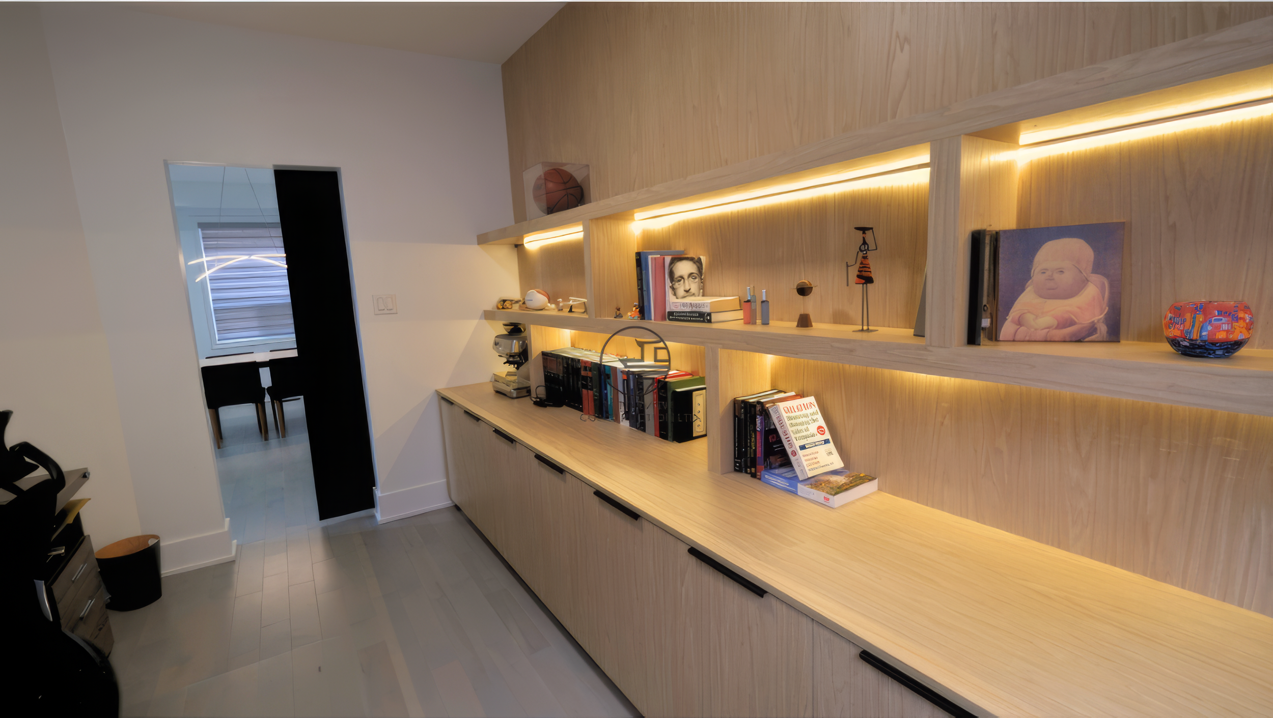 custom built-in shelving with wood cabinetry, LED lighting, and modern storage design