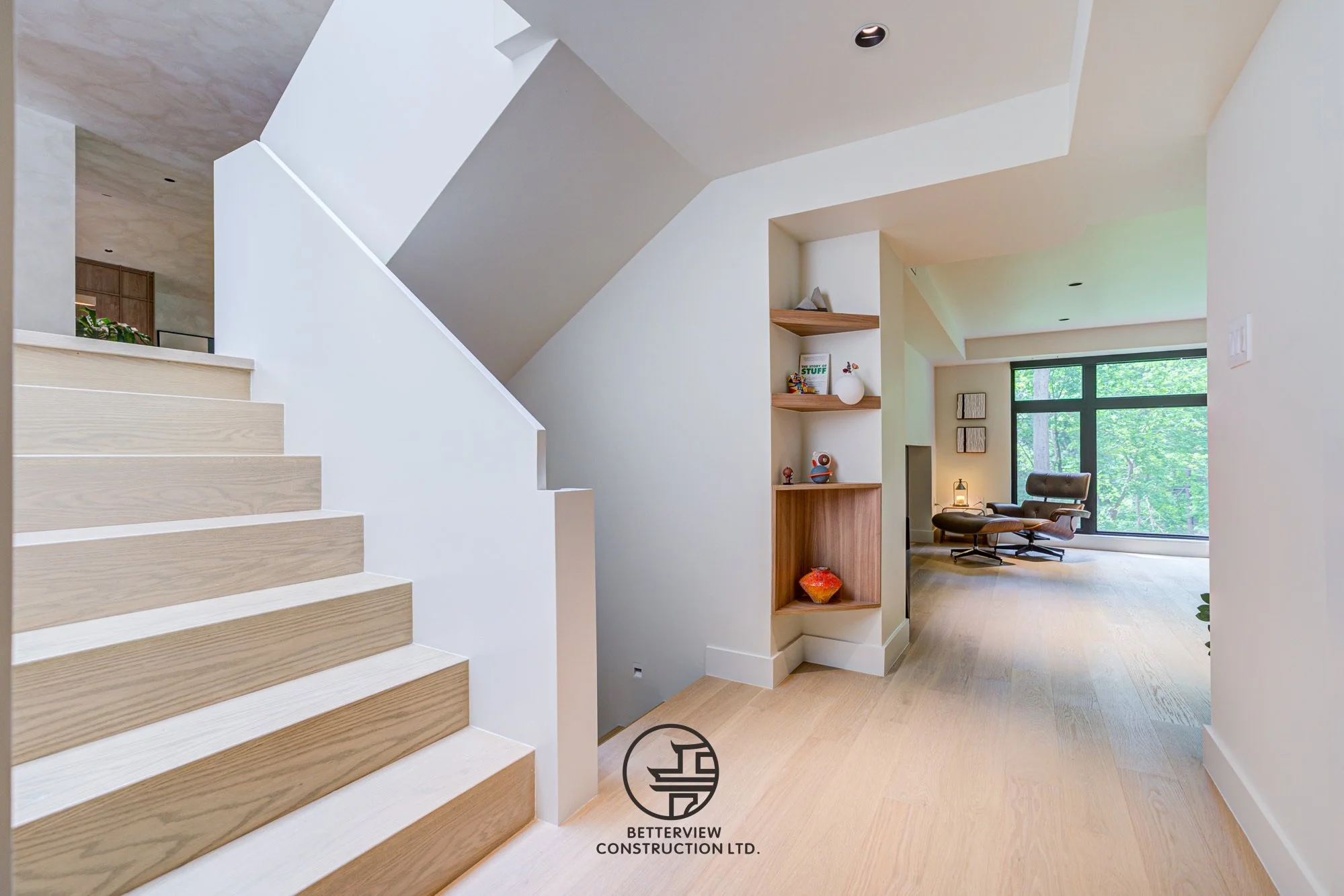 modern staircase and hallway in open concept home