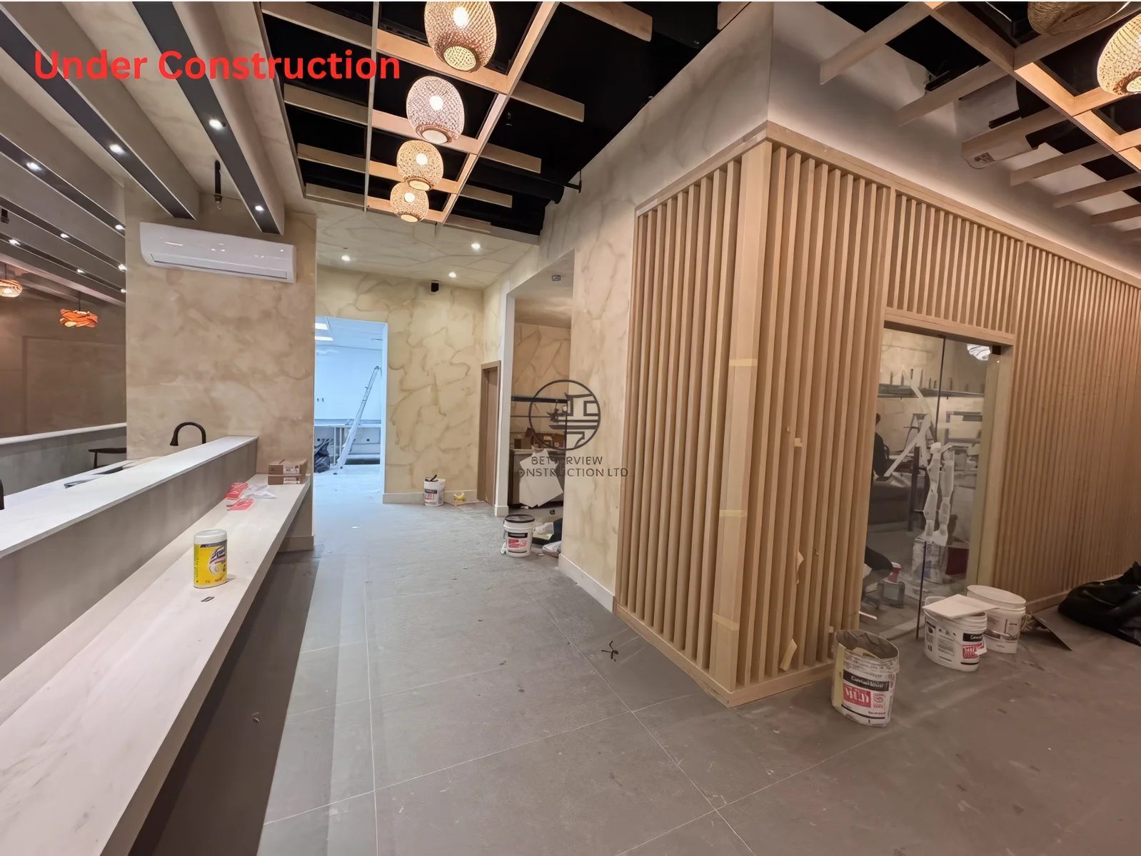 Restaurant renovation near completion in Toronto featuring wood slat feature wall, corridor design, and modern Japanese interior details