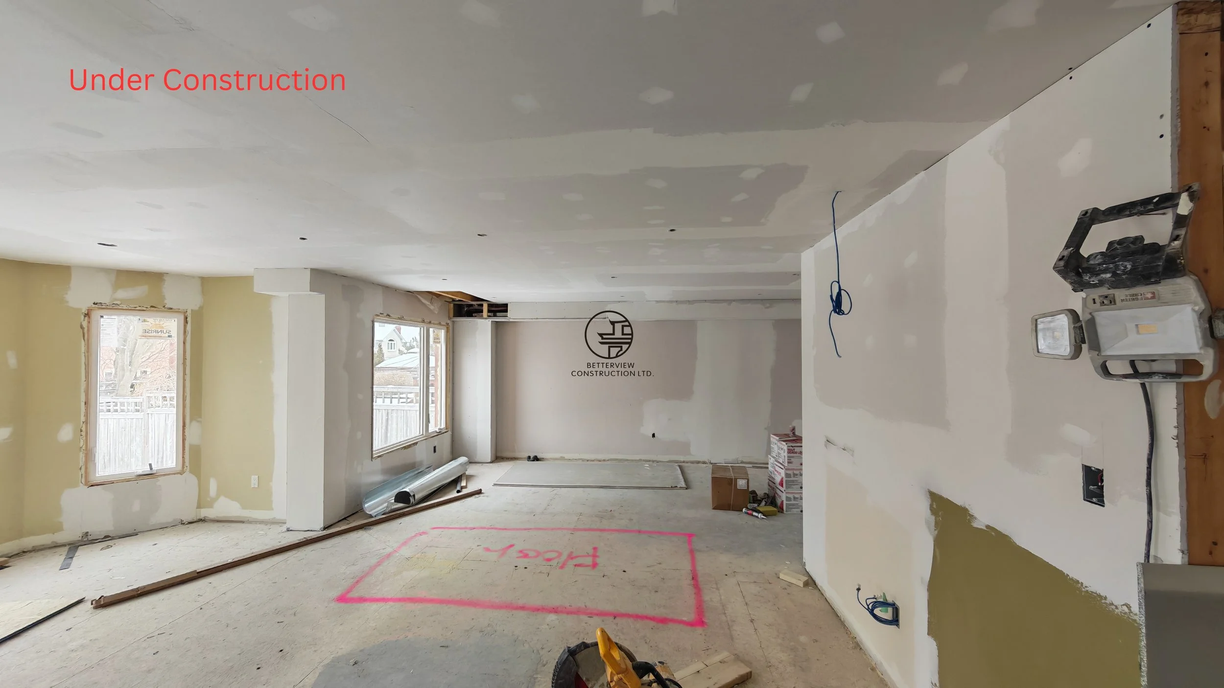home renovation drywall finishing stage with patched walls ceiling work exposed wiring and open layout in residential remodeling interior