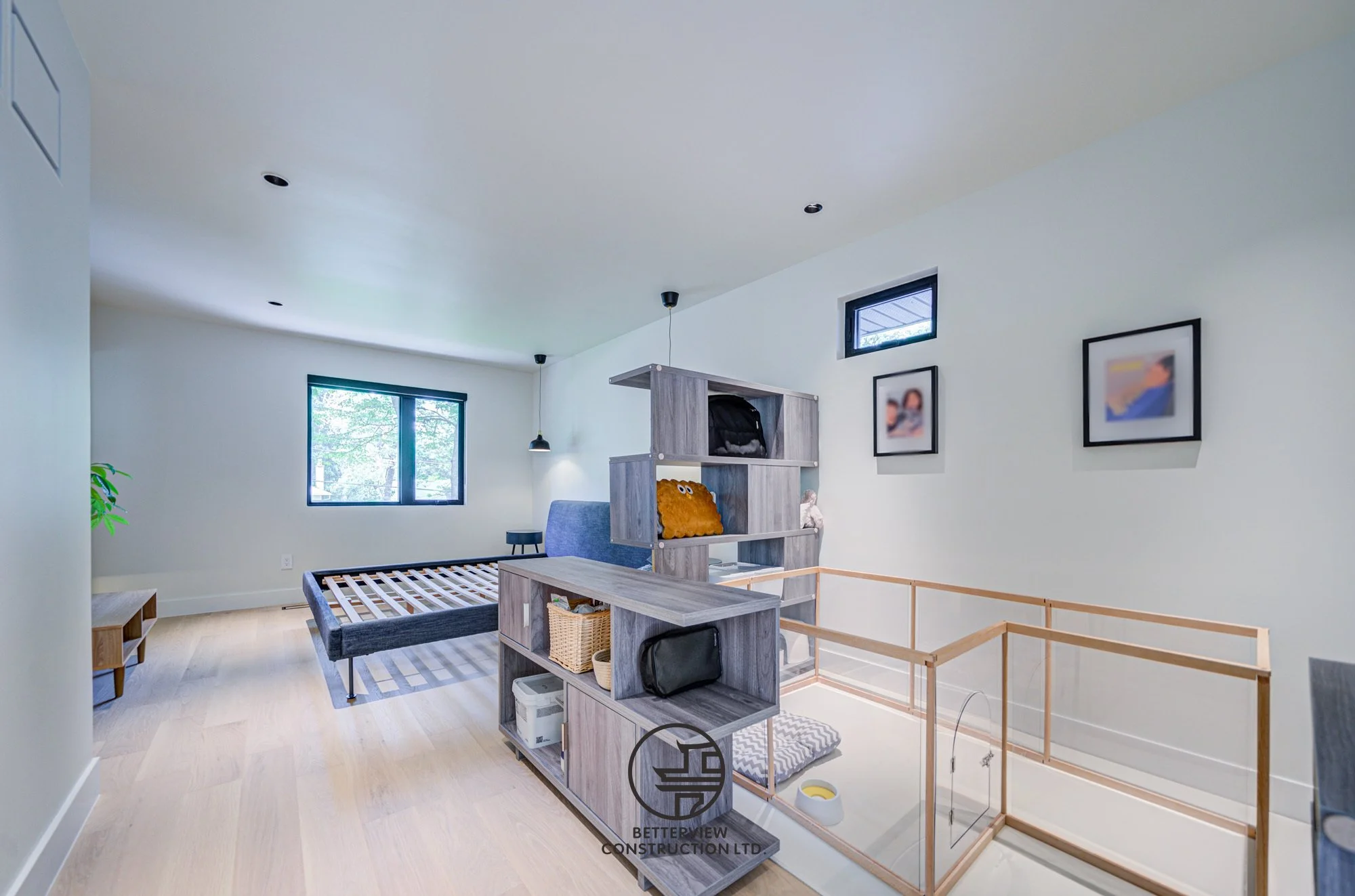modern loft living space with open railing in renovated home