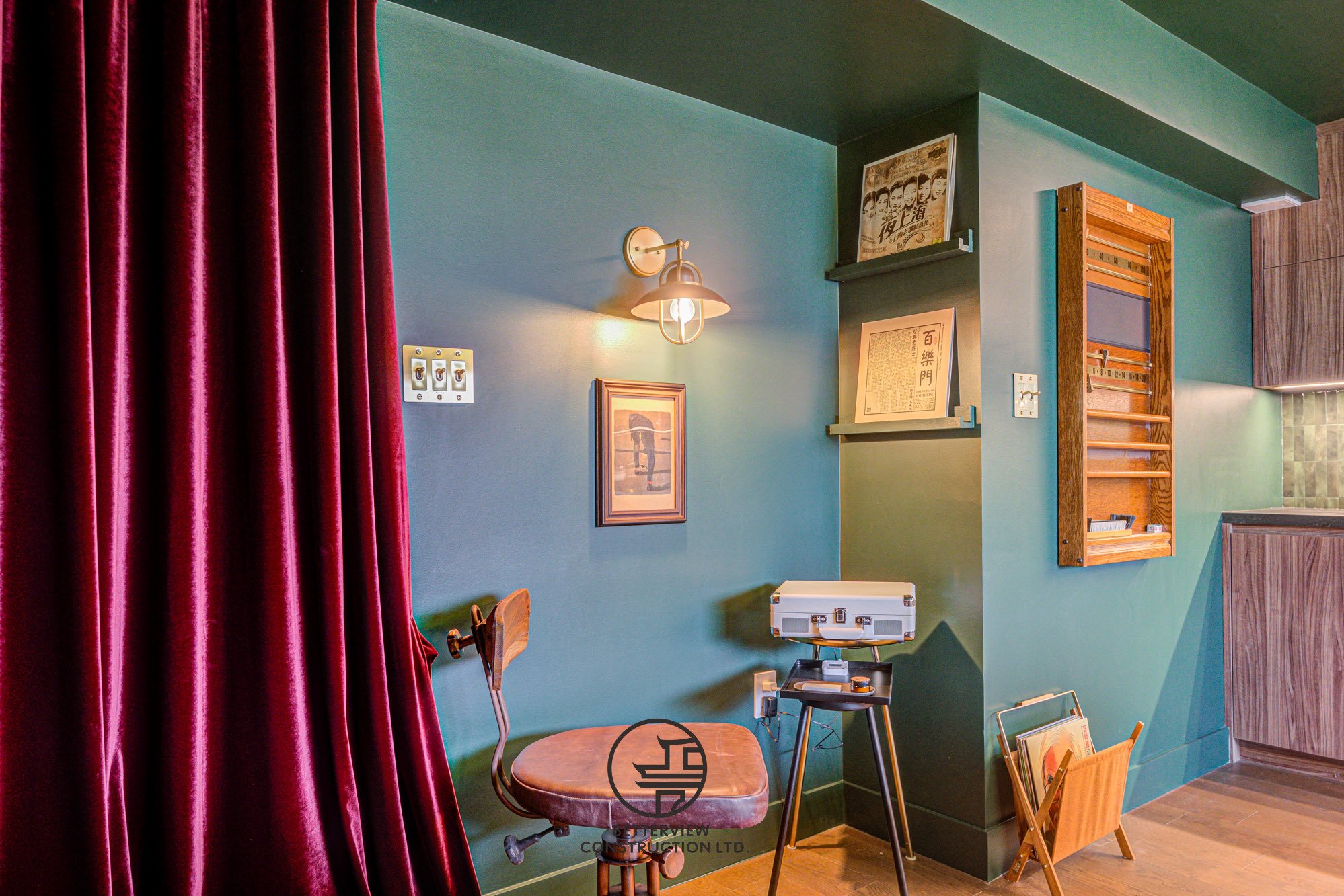 modern basement renovation with vintage style lounge corner and decorative wall shelves