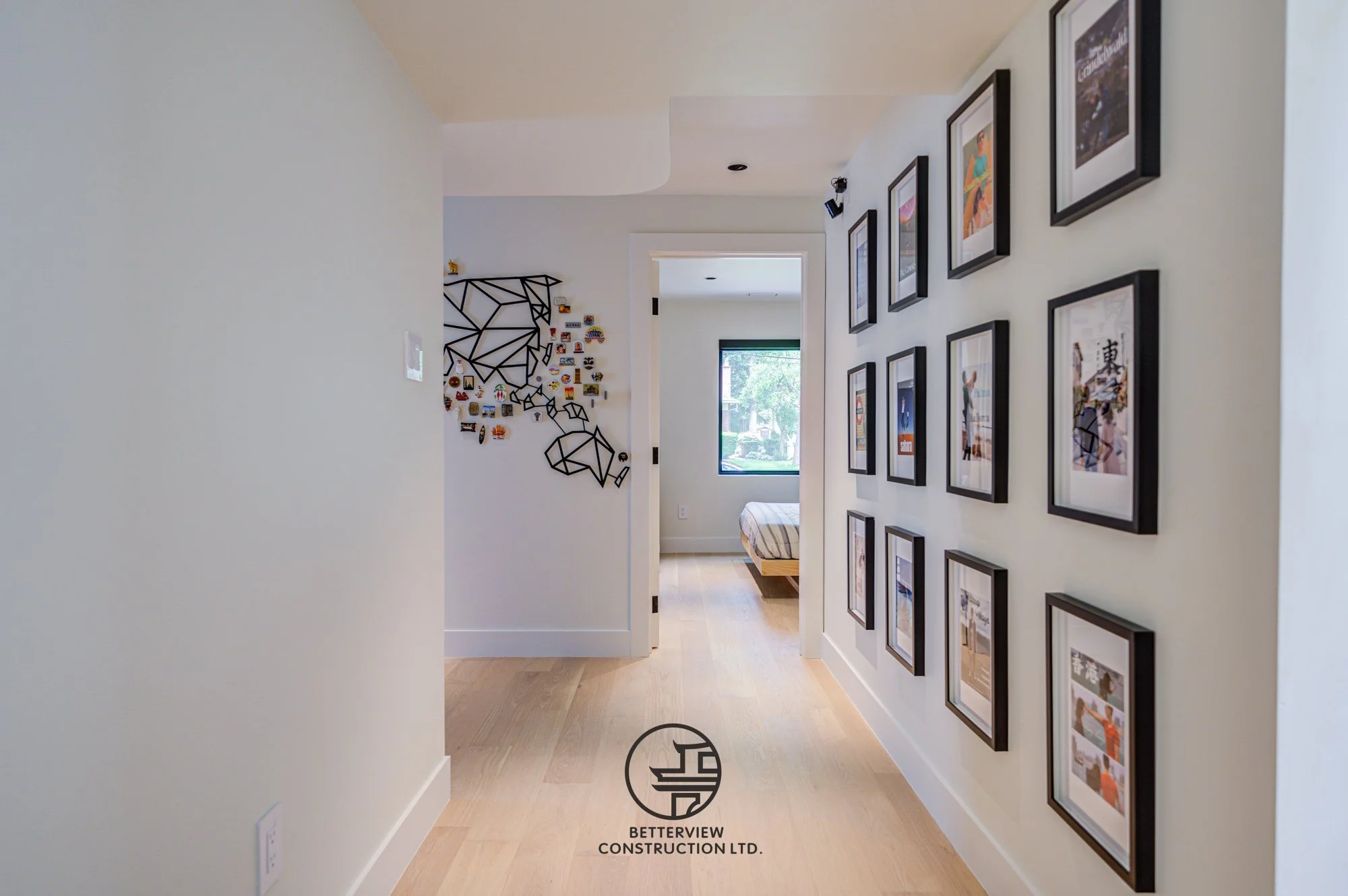 modern hallway with gallery wall and framed artwork