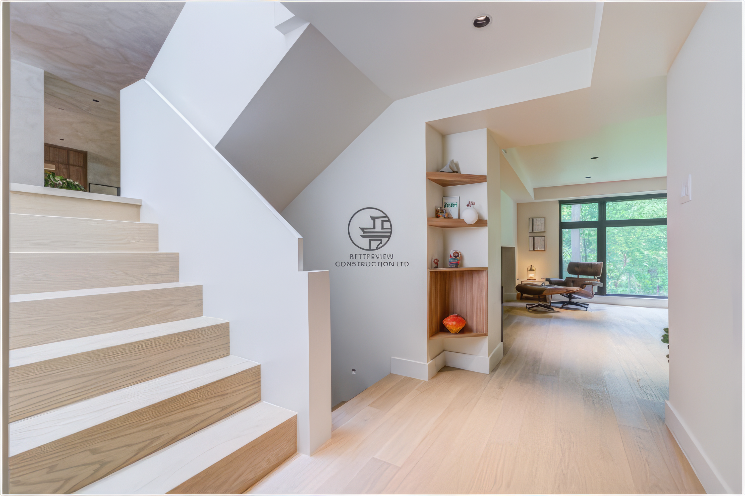 modern staircase and hallway in open concept home