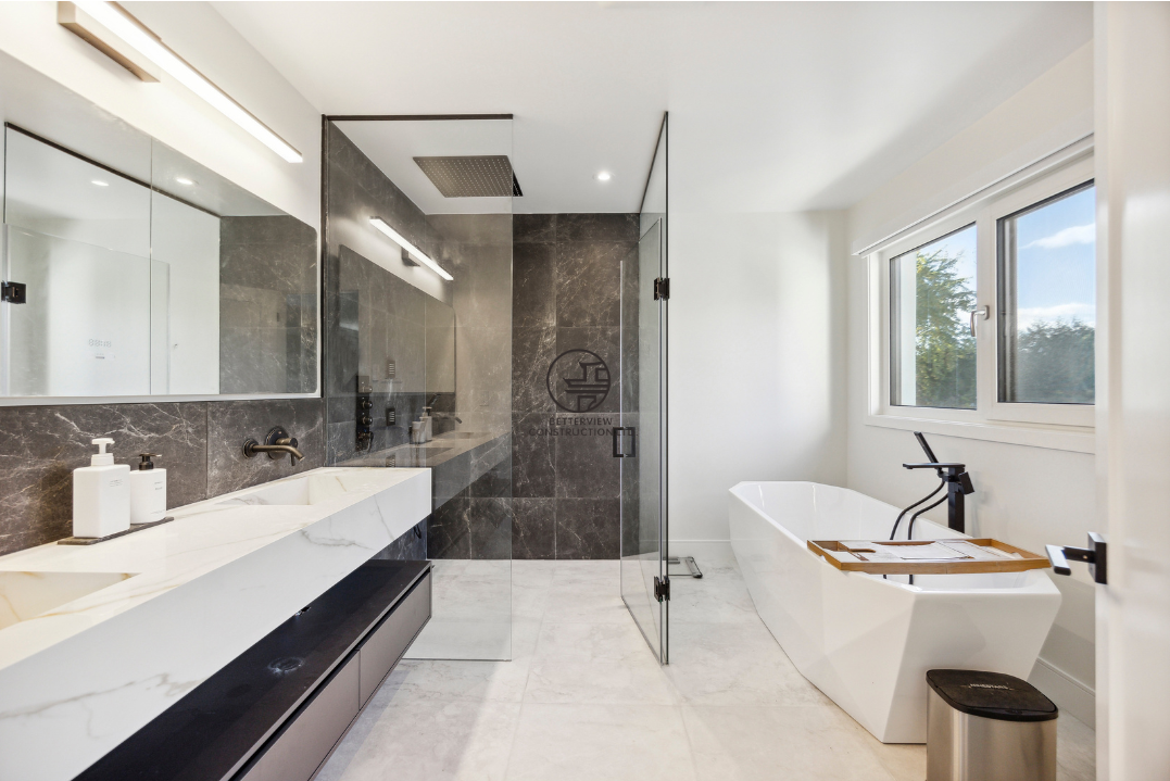 Modern bathroom renovation featuring a glass walk-in shower, freestanding bathtub, custom vanity, and contemporary finishes in a GTA home