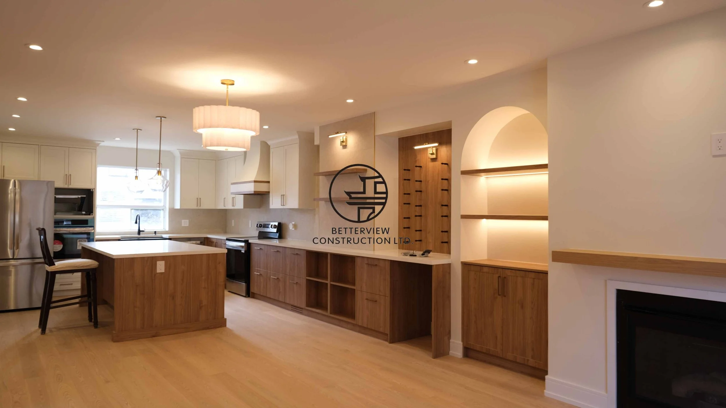 Modern open-concept living room and kitchen designed and built by Betterview Construction Ltd., featuring custom millwork and a clean contemporary interior design style, showcasing high-quality residential renovation, construction, and interior finis