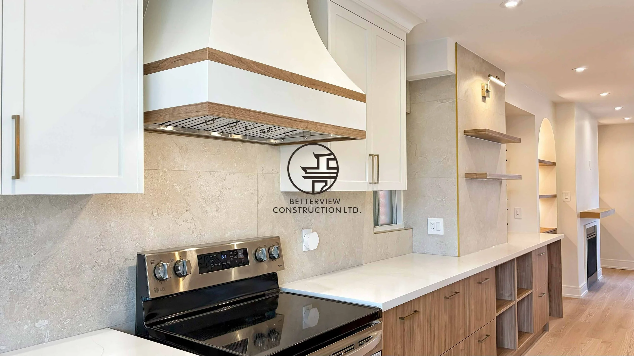 Modern kitchen renovation designed and built by Betterview Construction Ltd., featuring custom millwork cabinetry in warm natural wood tones, premium finishes, and a clean contemporary kitchen design, showcasing high-quality residential construction 