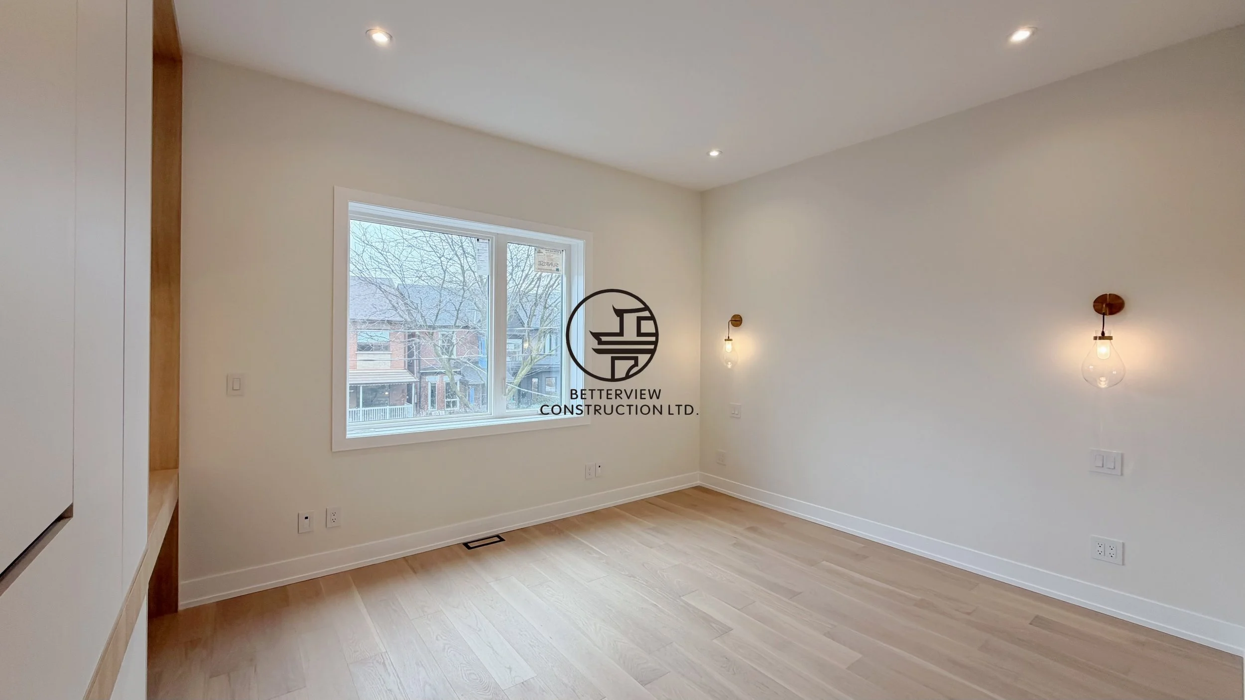 modern-bedroom-renovation-large-window-wall-sconces-hardwood-flooring-toronto.jpg.jpg