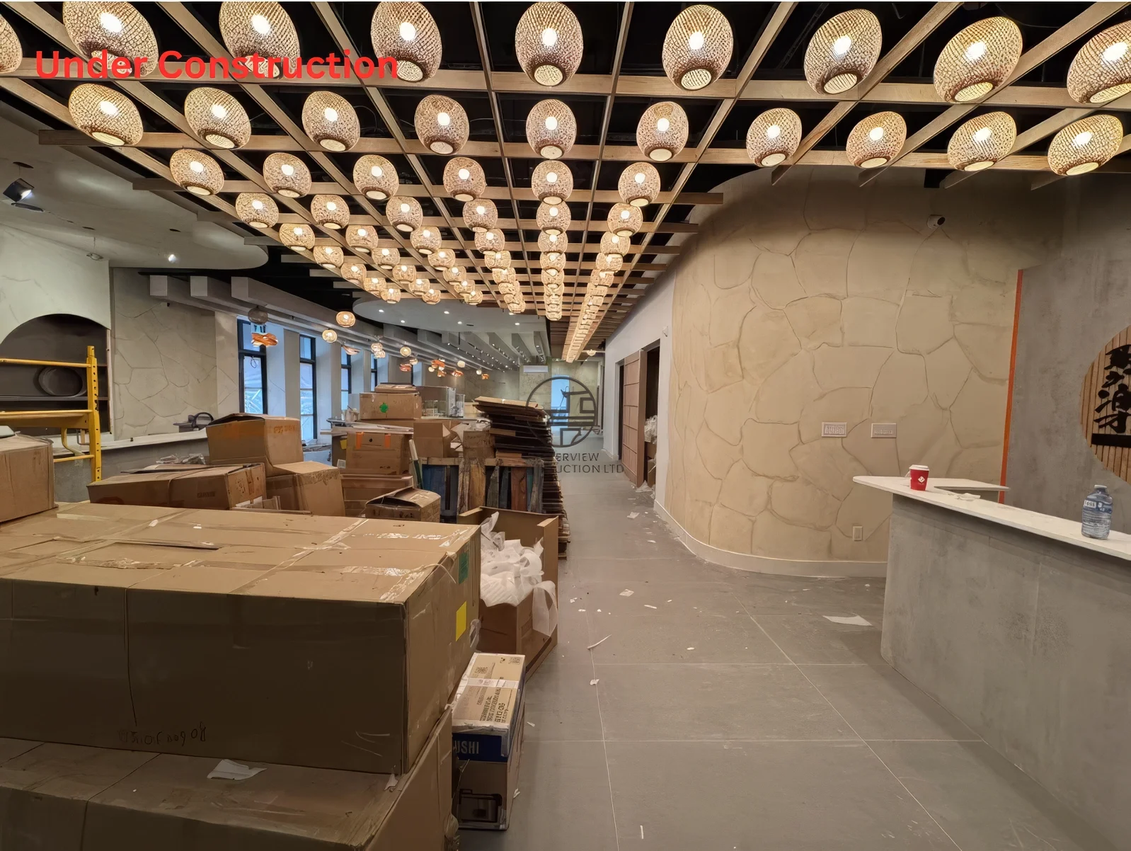 Restaurant renovation near completion in Toronto featuring custom ceiling lighting design, Japanese interior style, and modern dining space