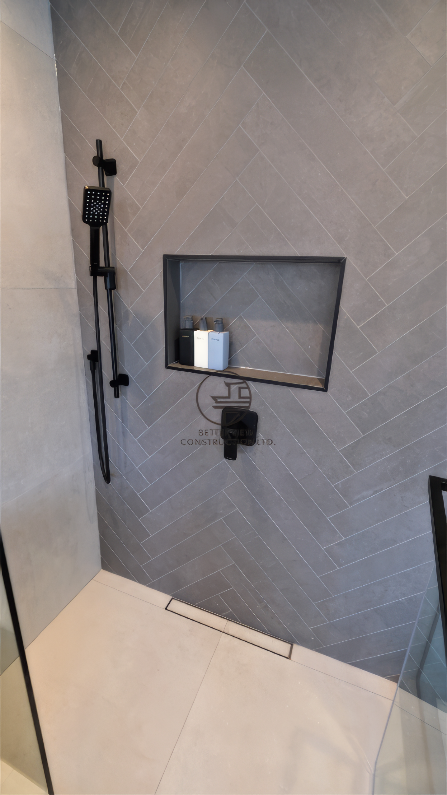 modern bathroom renovation walk in shower with herringbone tile and black fixtures