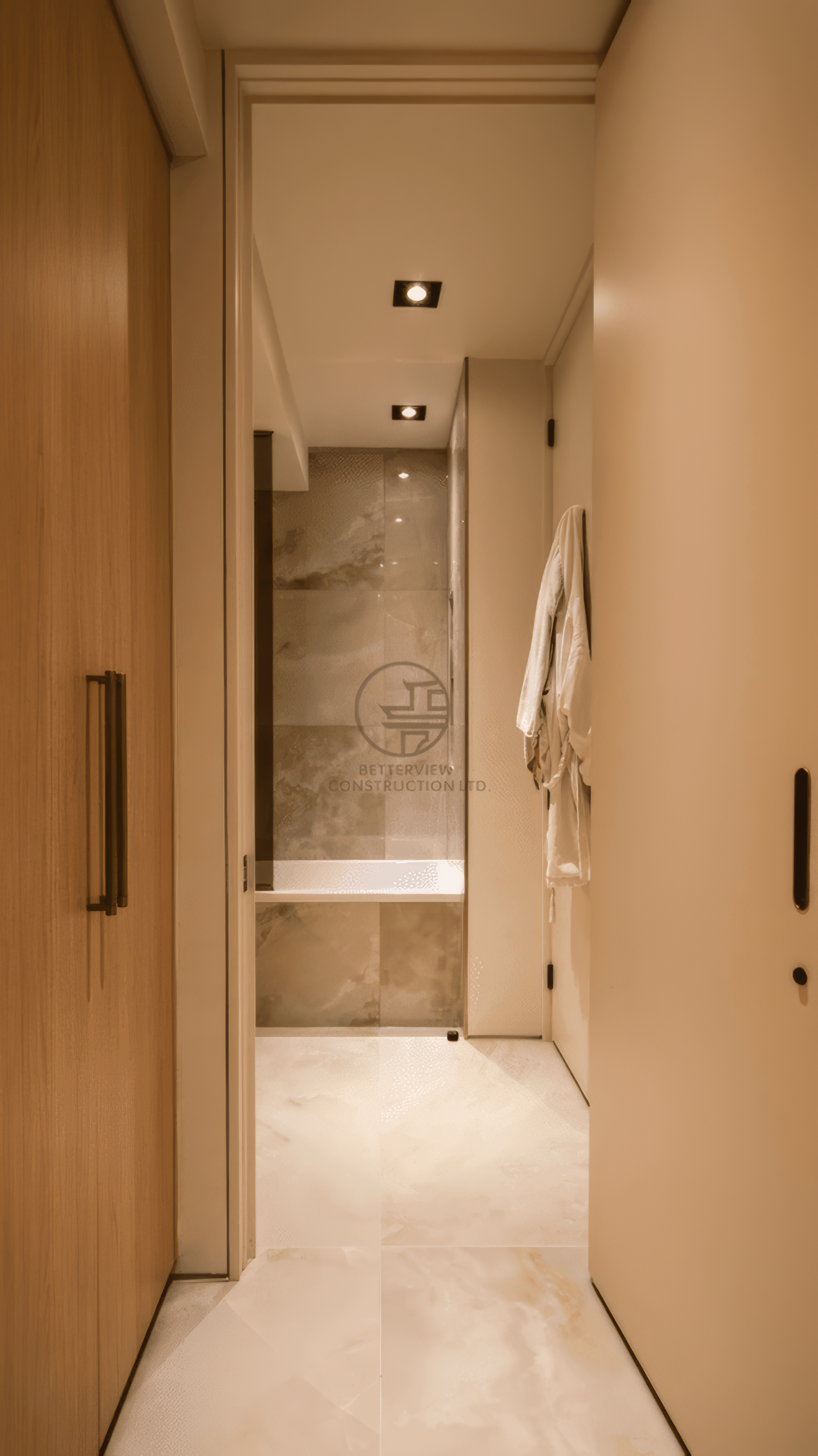 modern hallway leading to bathroom with concealed doors