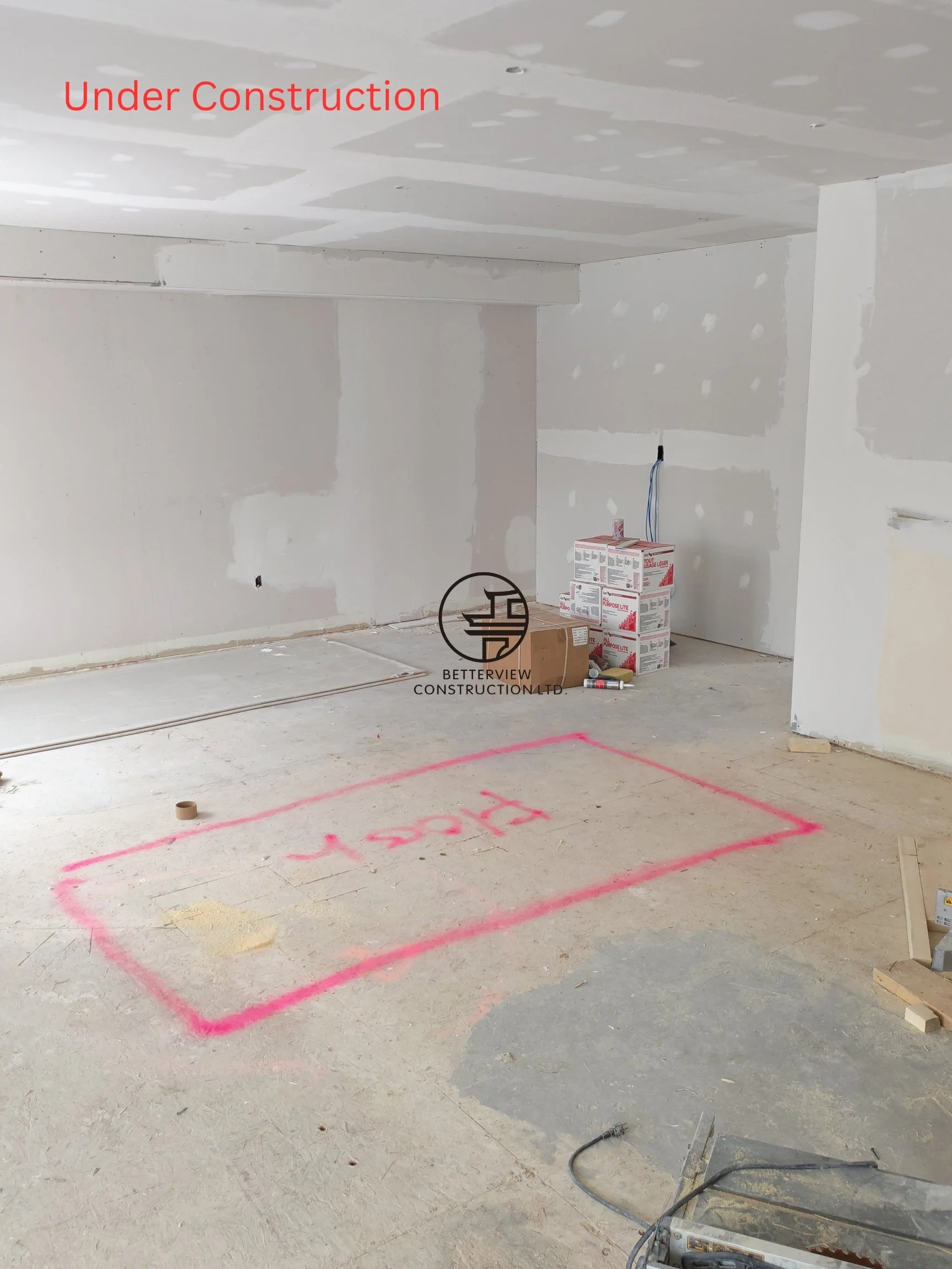 home renovation drywall stage with finished wall panels ceiling patching and open layout space in residential remodeling project