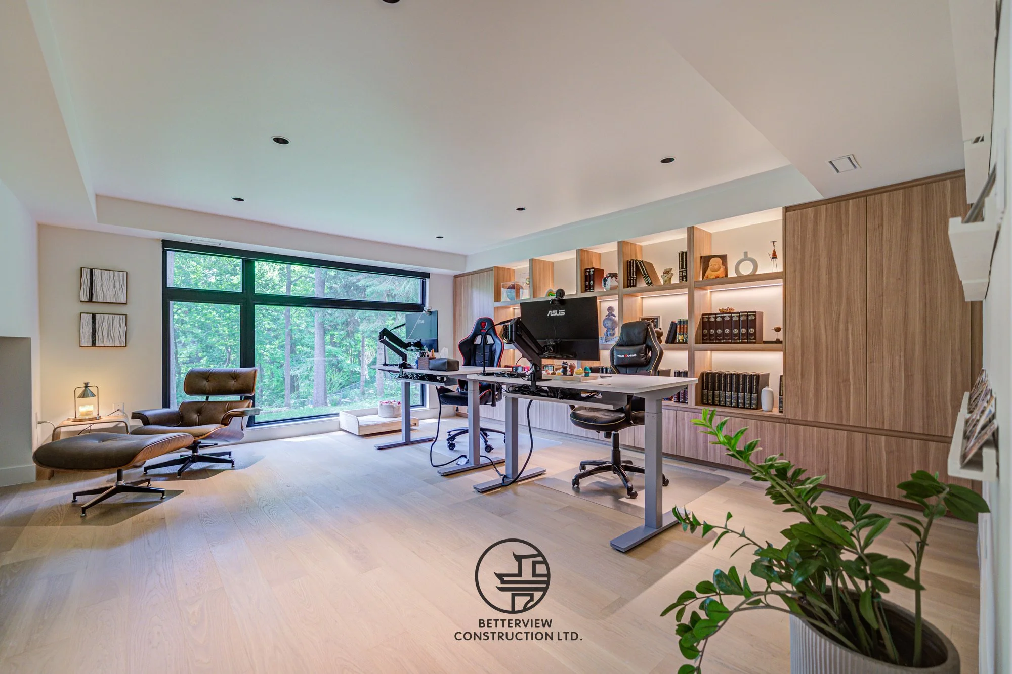 modern home office workspace with dual desks and built in shelves