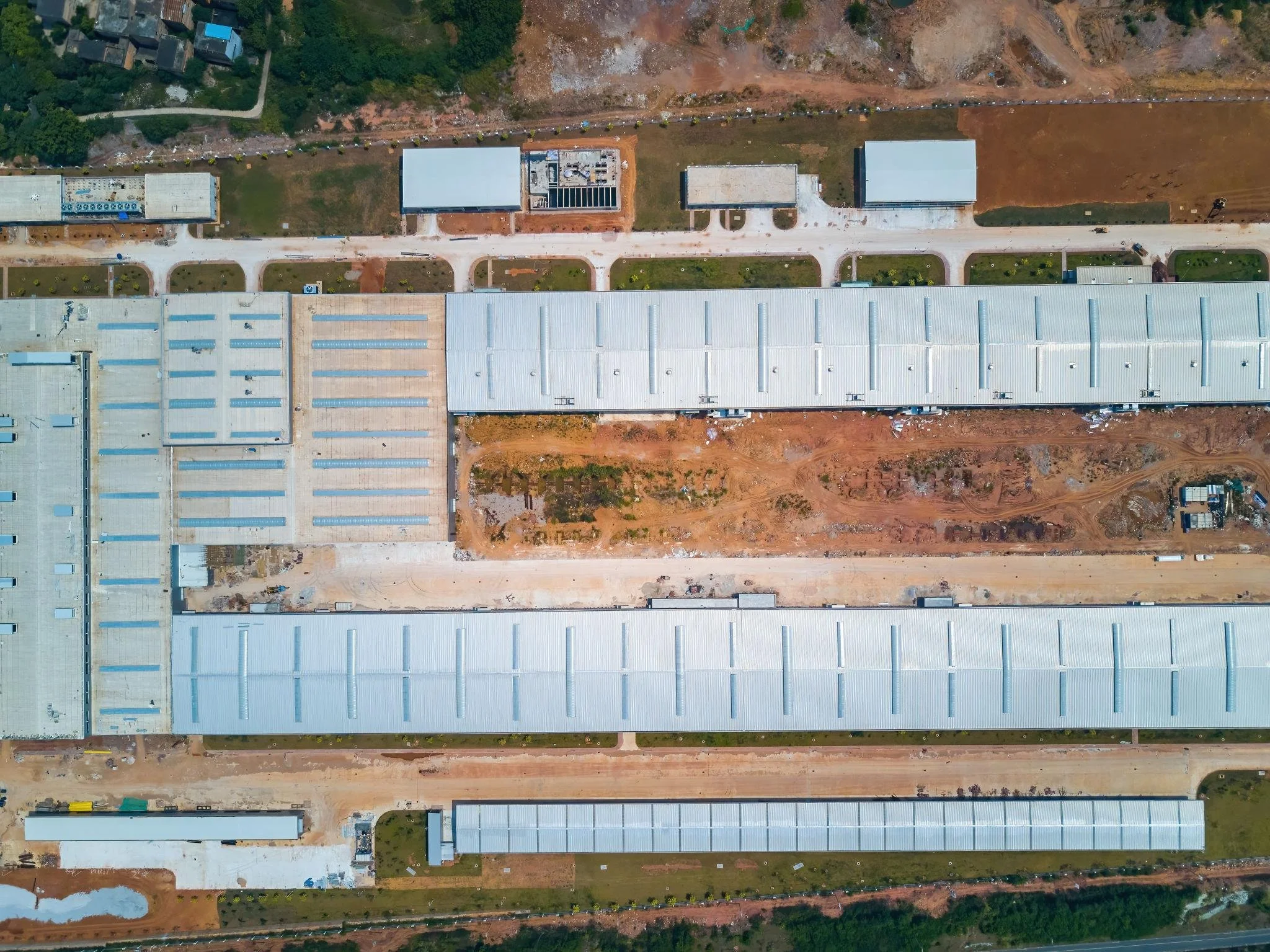 Aerial view of large industrial warehouse complex with multiple buildings and site layout
