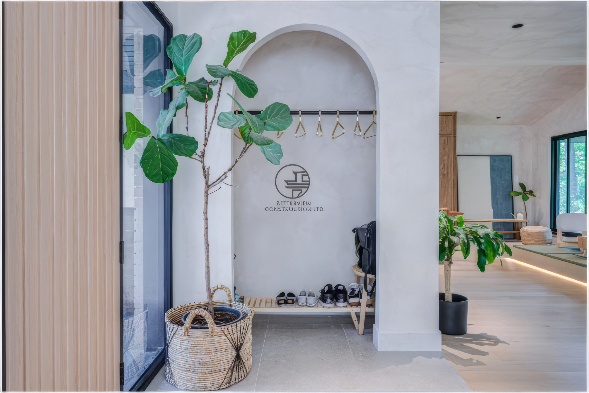 modern entryway storage nook with coat rack and arched niche
