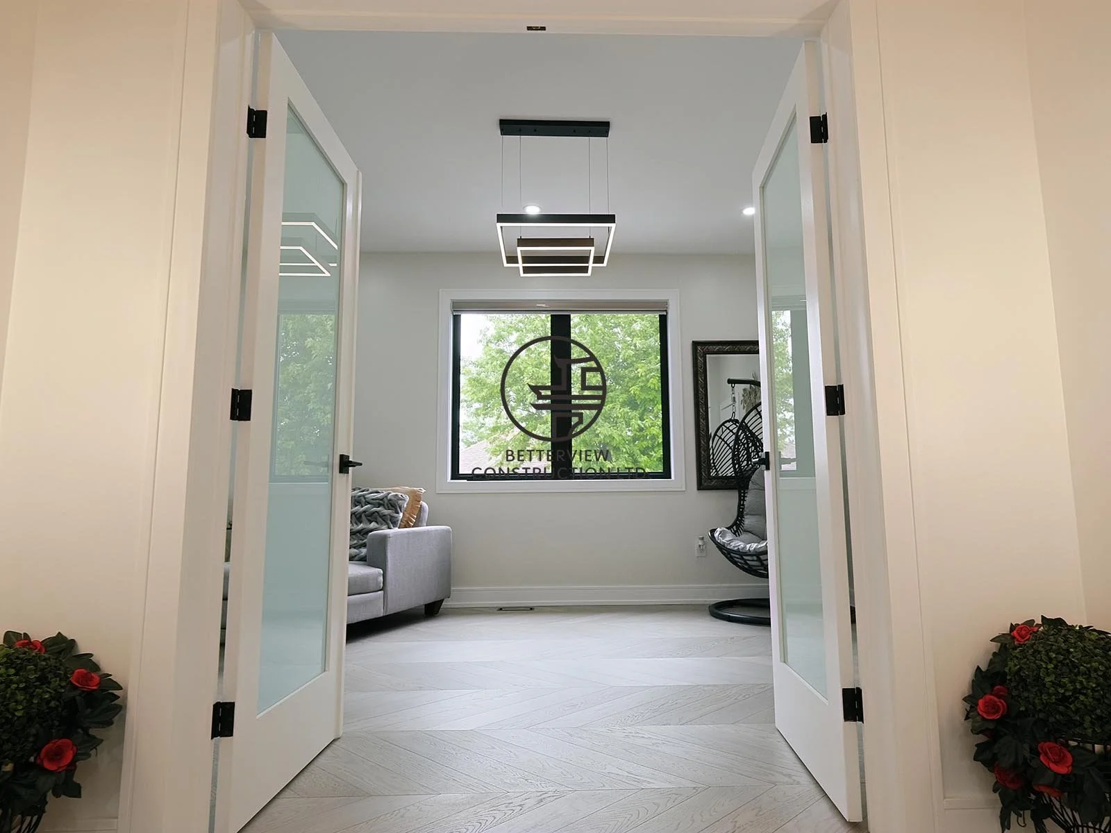 The upper-level hallway features wide walkways, modern interior doors, and abundant natural light, enhancing the home's bright and open atmosphere.