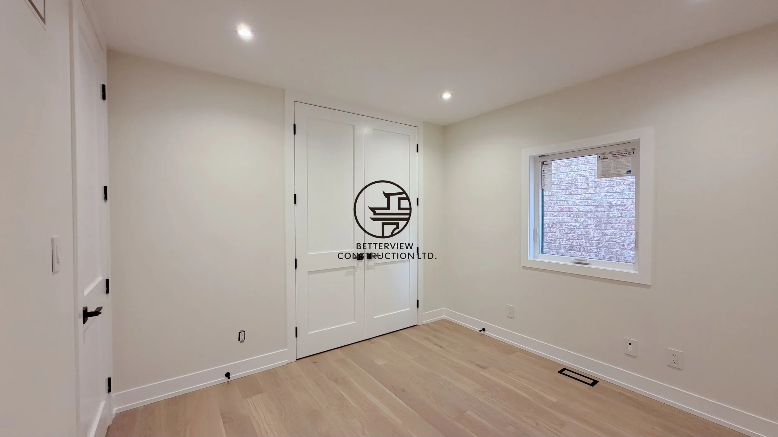 modern-bedroom-renovation-double-closet-doors-hardwood-flooring-toronto.jpg.jpg