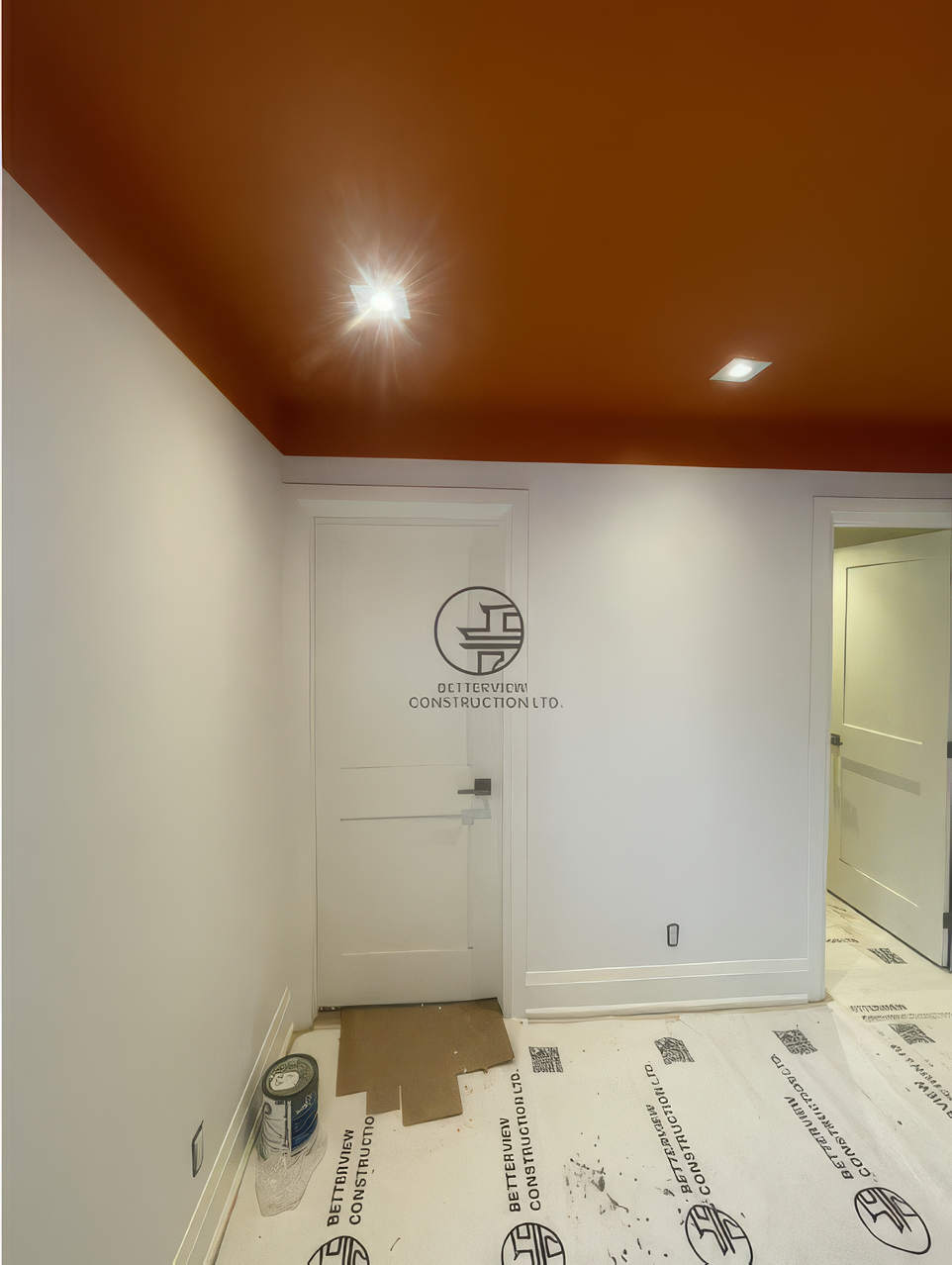 modern-home-renovation-orange-ceiling-interior-finishing-door-installation.png