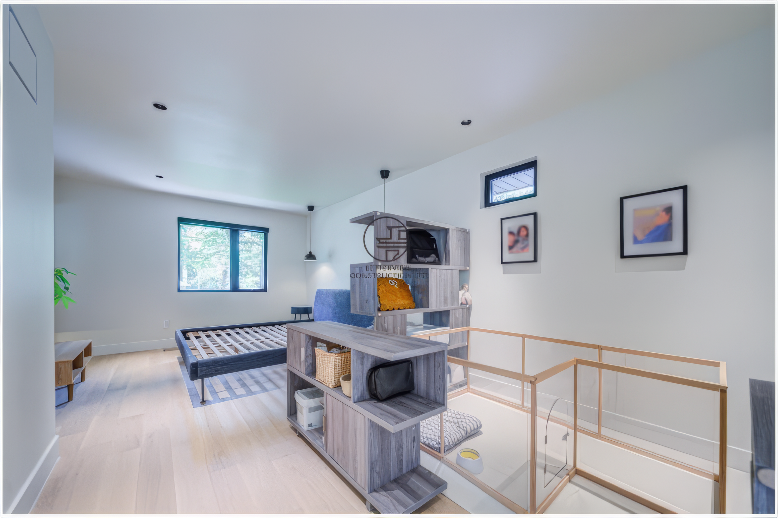 modern loft living space with open railing in renovated home