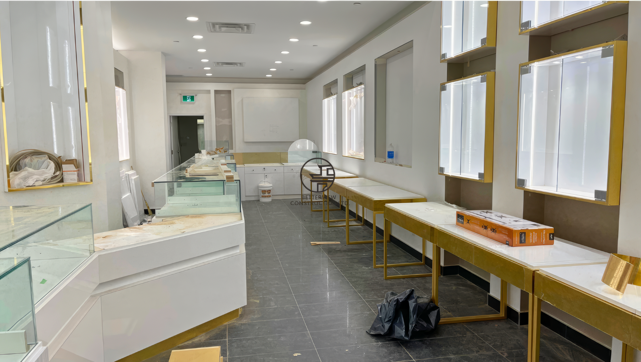 Luxury jewelry store interior during renovation with custom display counters and wall showcases installation in Toronto