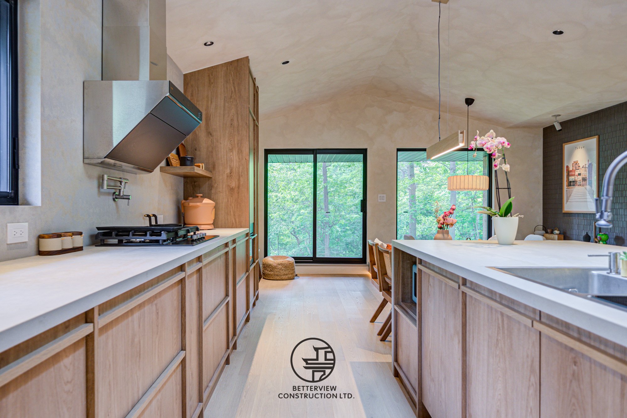 modern galley kitchen with wood cabinets and island