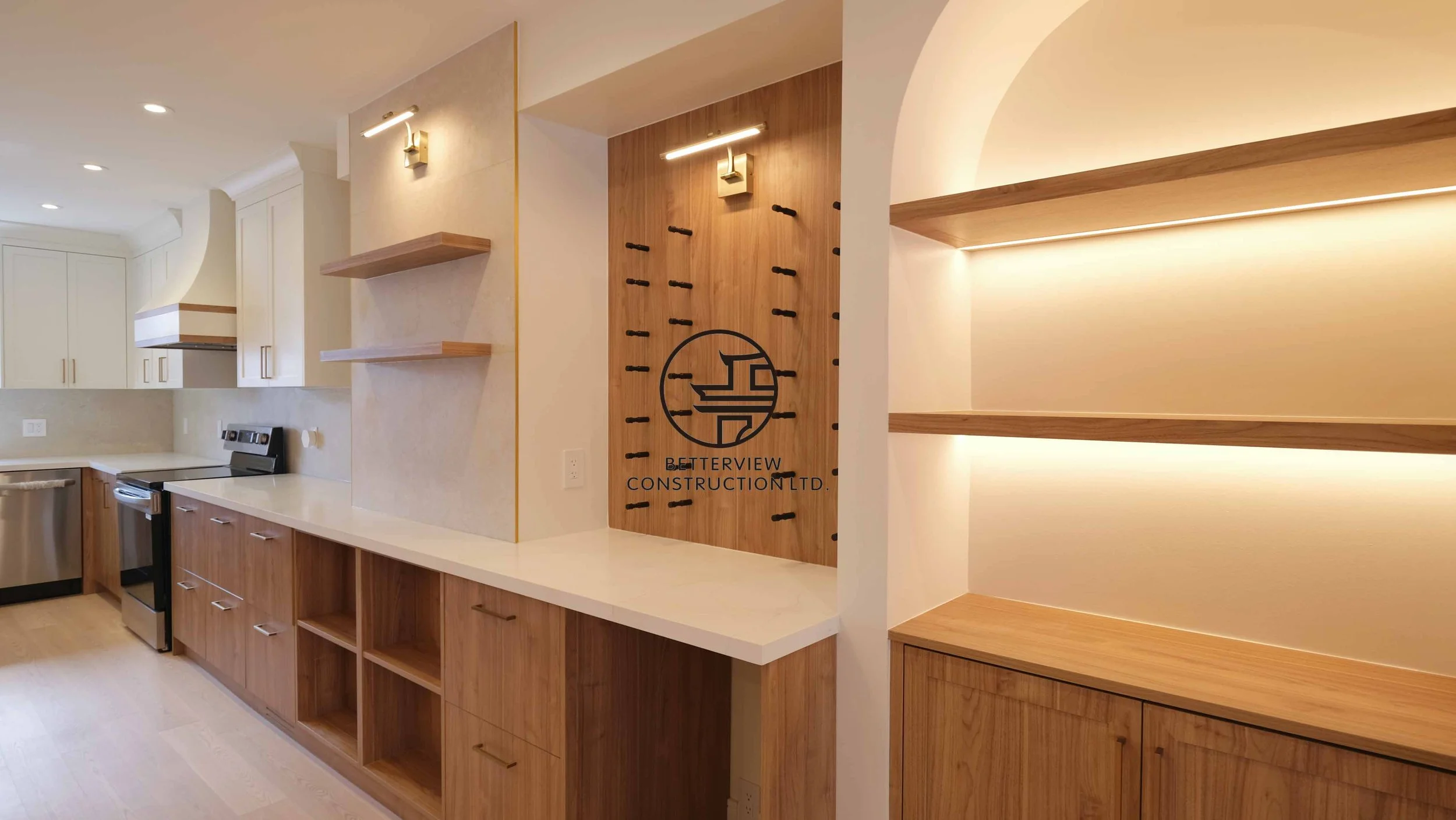 Modern open-concept living room and kitchen designed and built by Betterview Construction Ltd., featuring custom millwork and a clean contemporary interior design style, showcasing high-quality residential renovation, construction, and interior finis