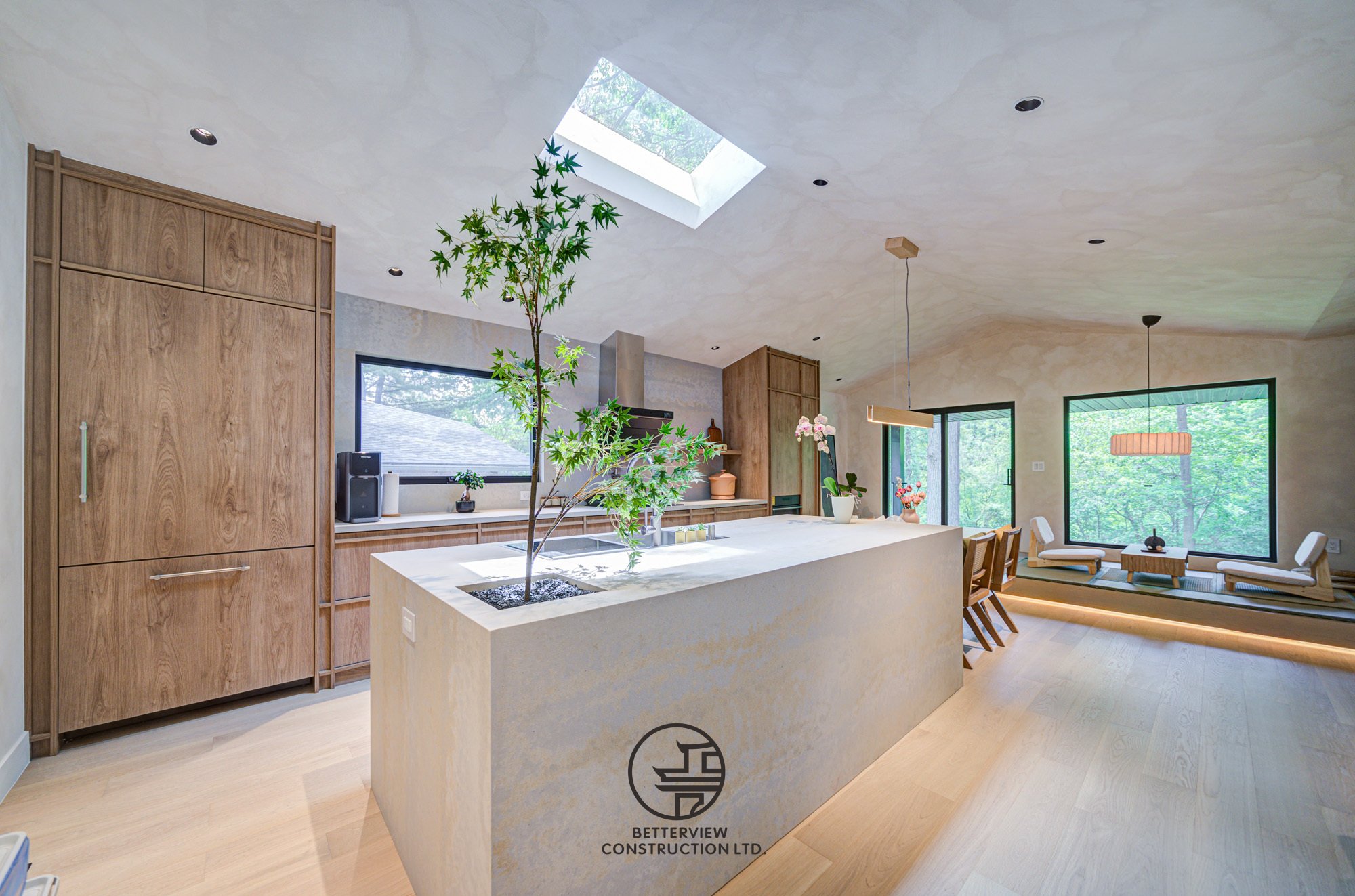 open concept kitchen with island and skylight