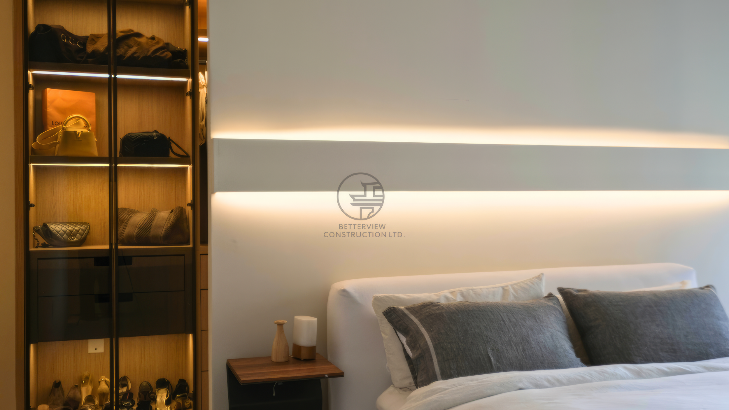 modern bedroom with LED headboard wall and built-in closet display