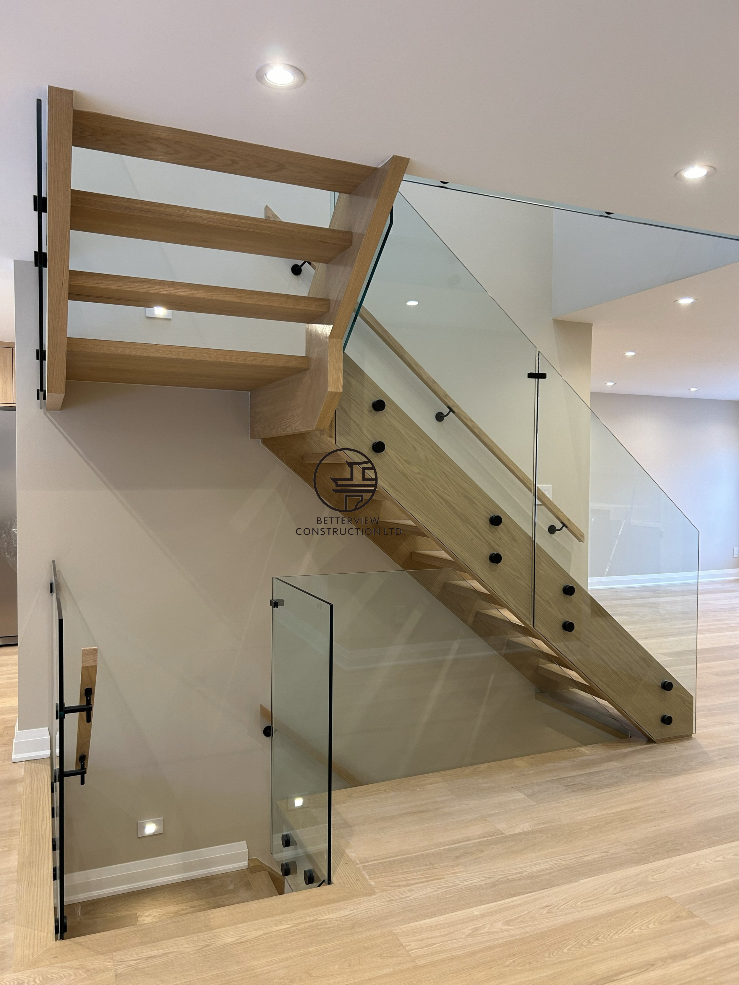 floating-wood-staircase-glass-railing-structural-renovation.png.png