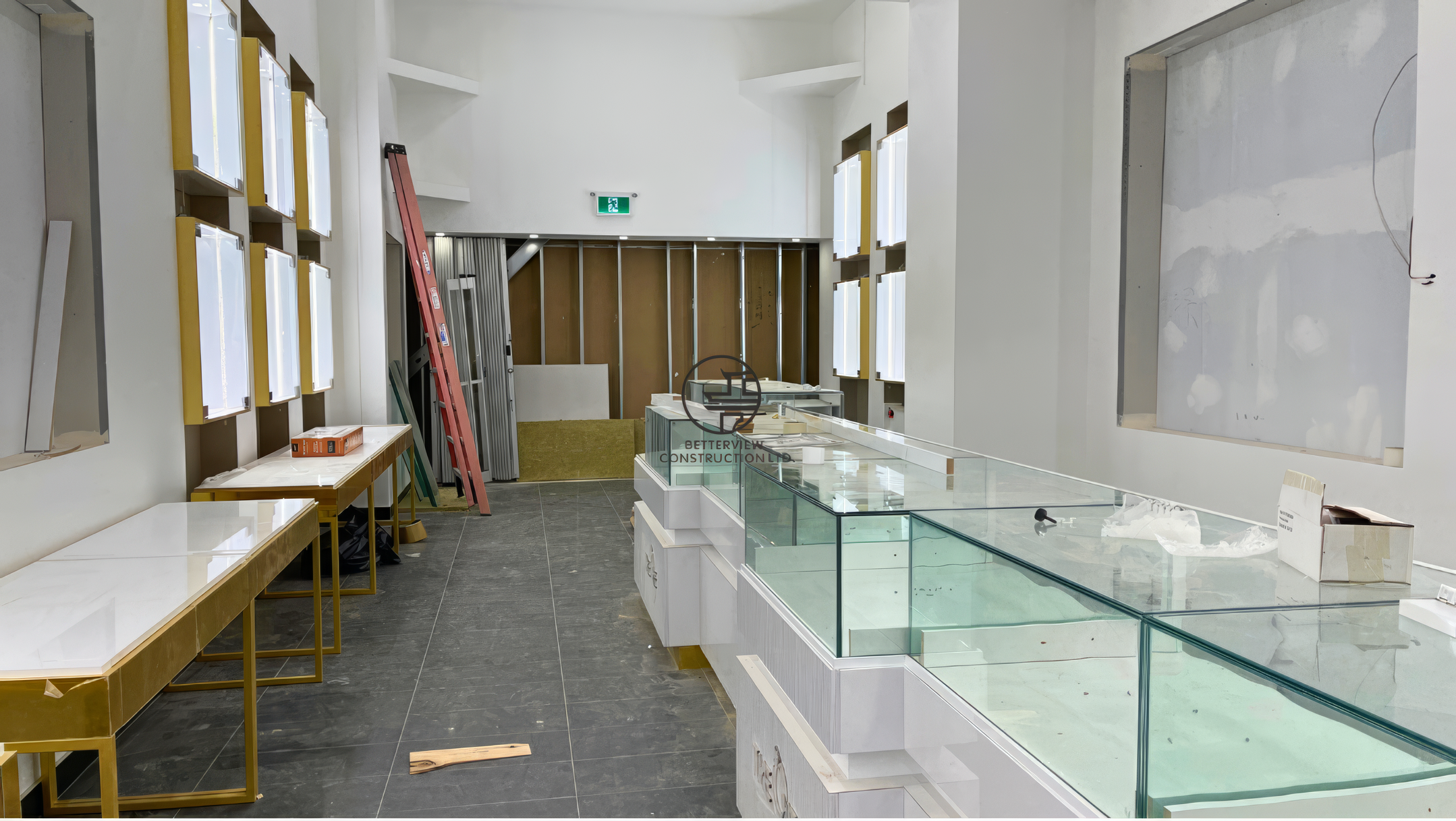 Retail store interior with installed glass display counters and ongoing finishing work during commercial renovation in Toronto