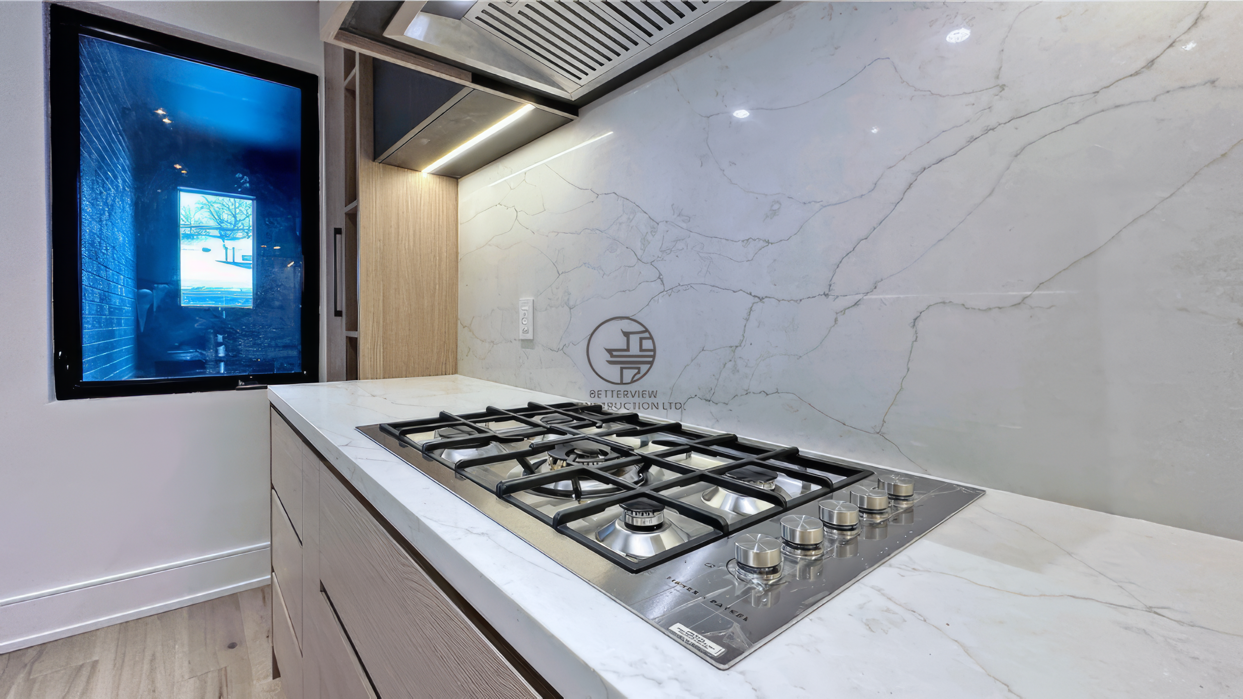 custom-kitchen-gas-cooktop-and-marble-backsplash-after-renovation.jpg.png
