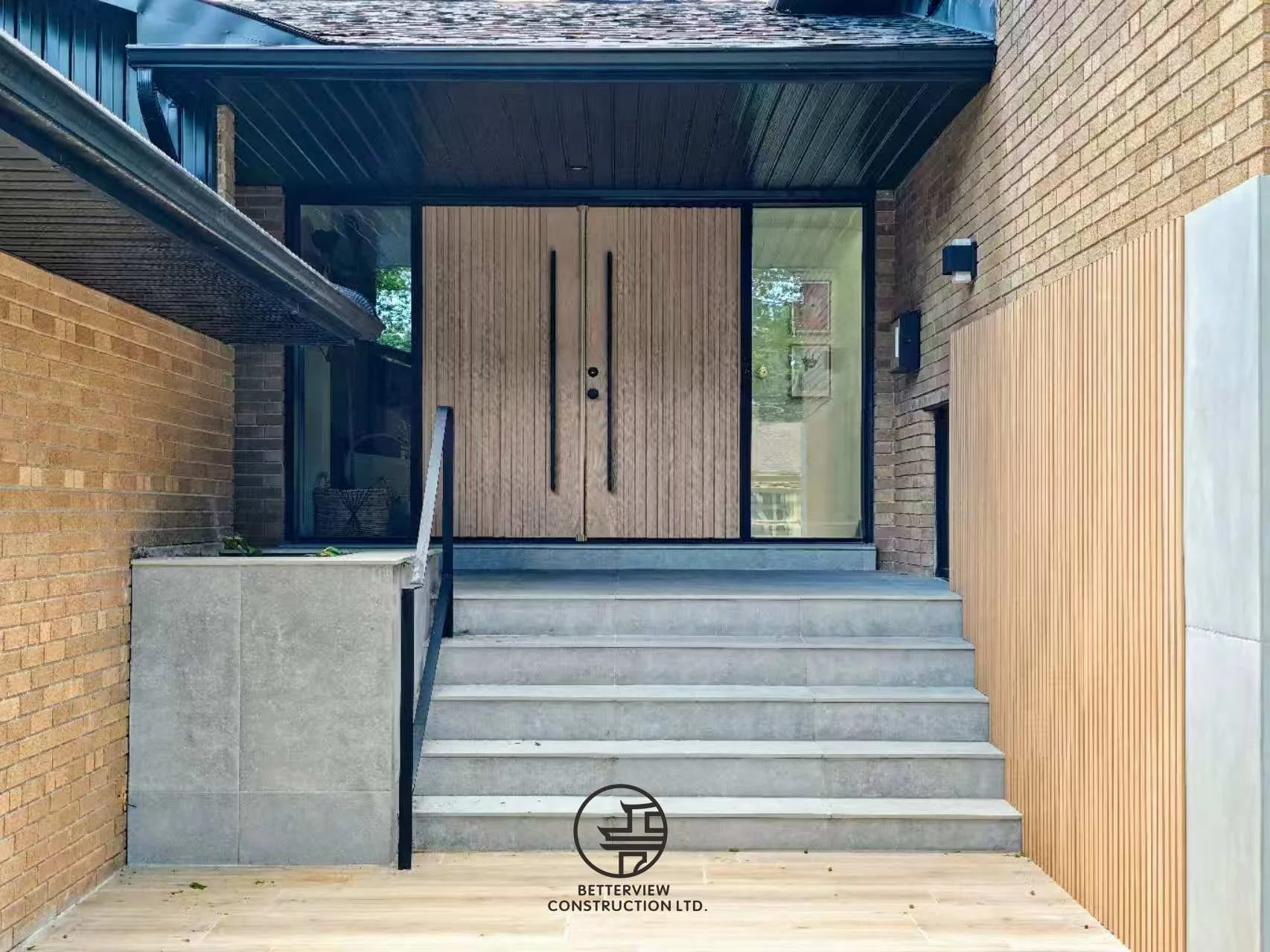 modern home front entrance with wood double door and concrete steps