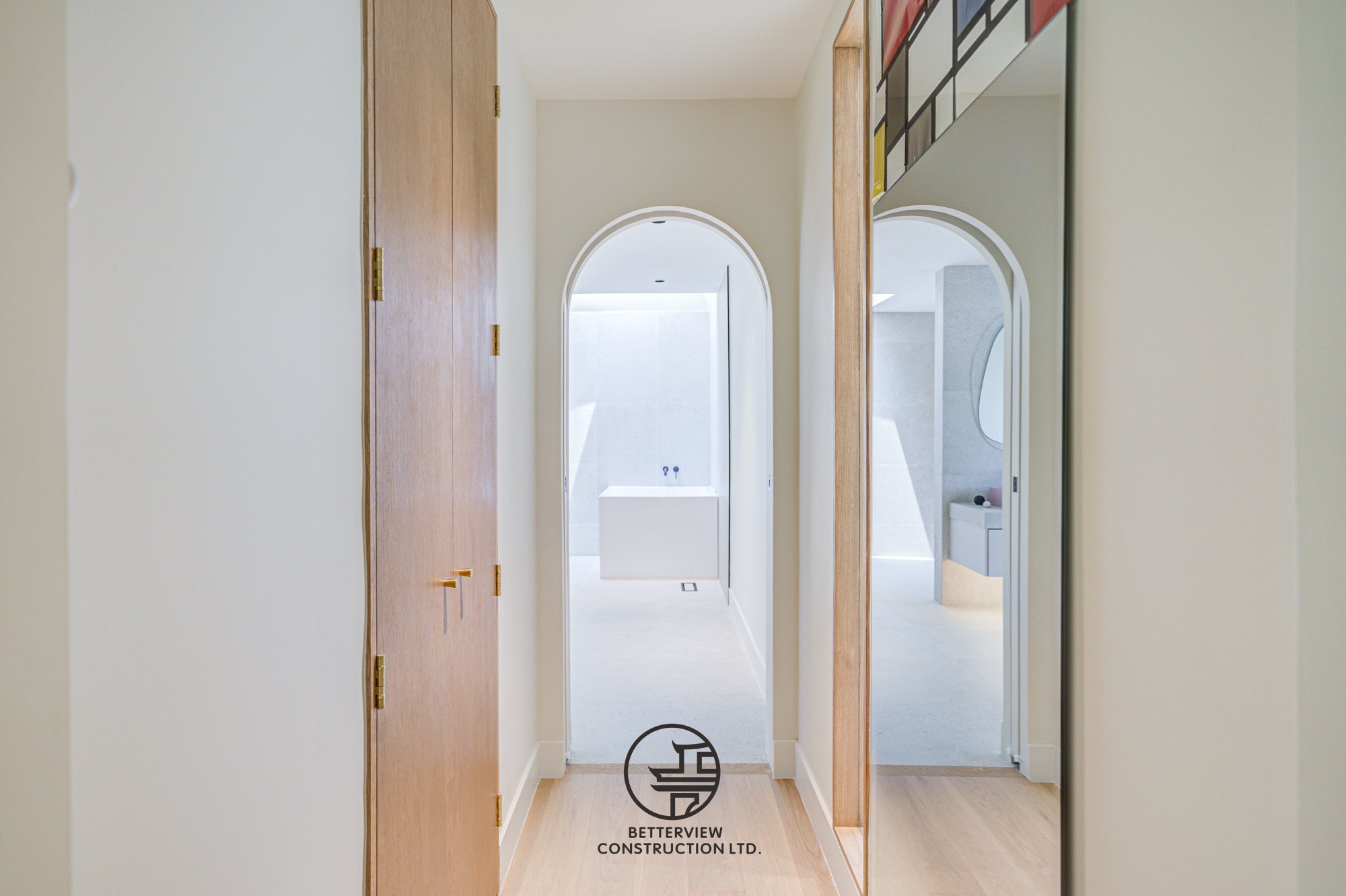 modern hallway with arched doorway in a minimalist home renovation
