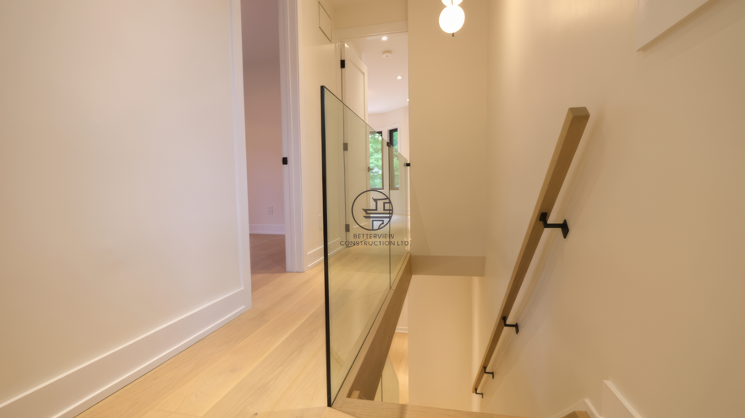 modern-staircase-glass-railing-hallway-renovation-toronto.jpg.png