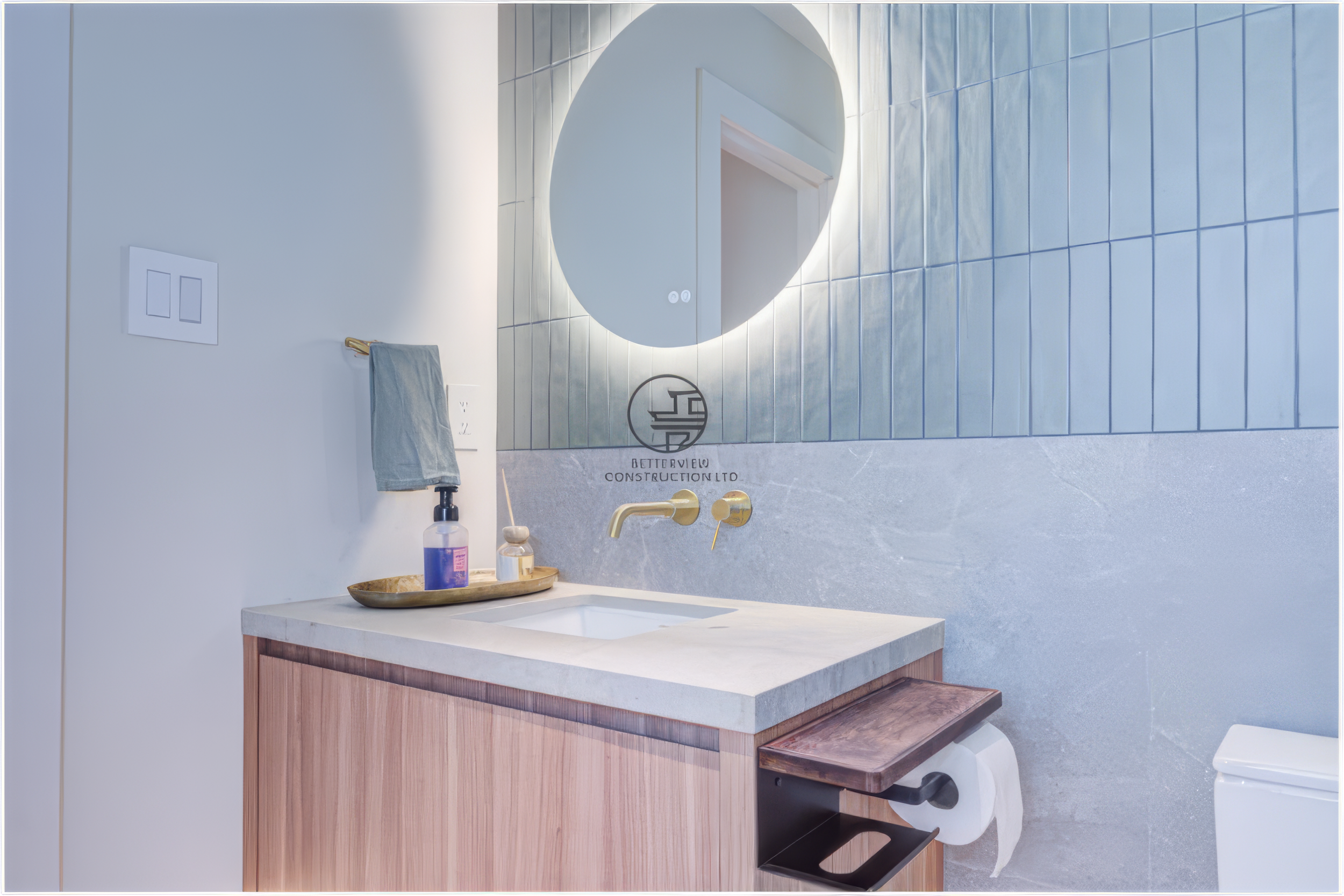 modern guest bathroom vanity with round LED mirror and wood cabinet