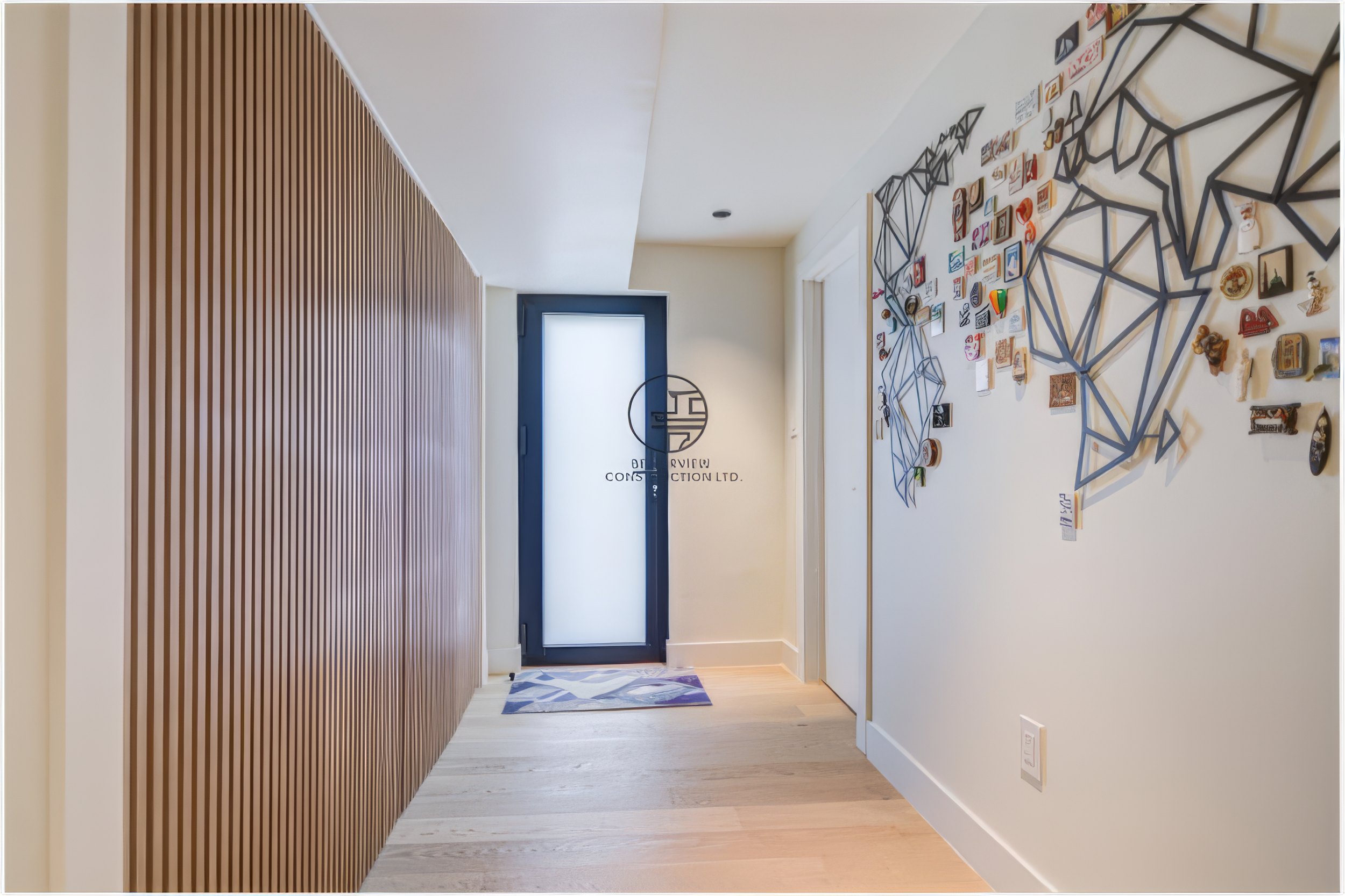 modern home entryway renovation with wood slat accent wall and minimalist design
