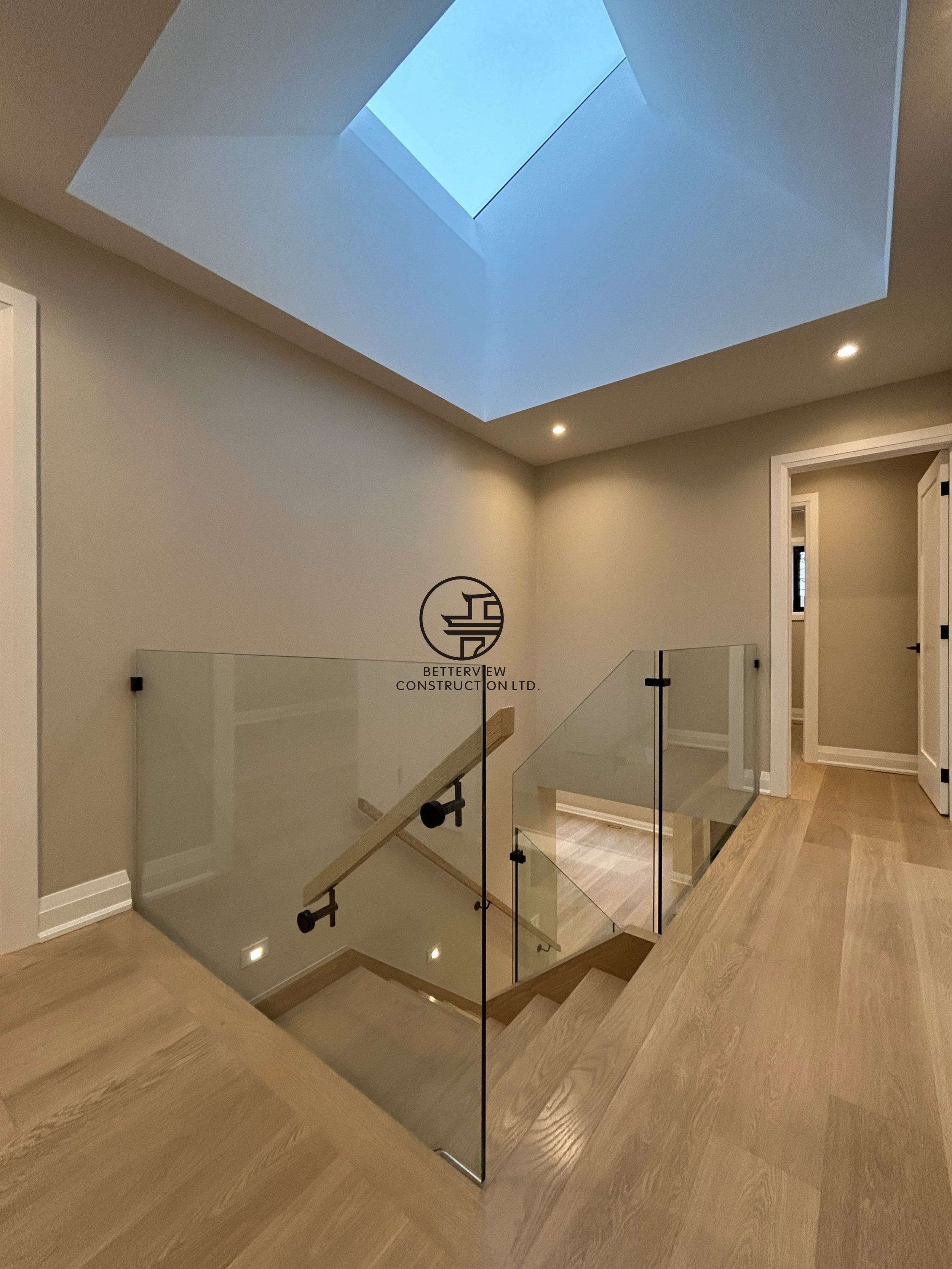 skylight-stairwell-glass-railing-modern-home.png.png