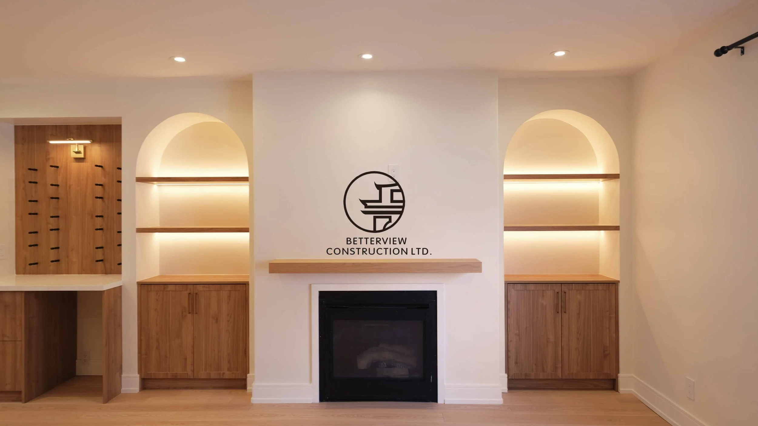 Modern open-concept living room and kitchen designed and built by Betterview Construction Ltd., featuring custom millwork and a clean contemporary interior design style, showcasing high-quality residential renovation, construction, and interior finis