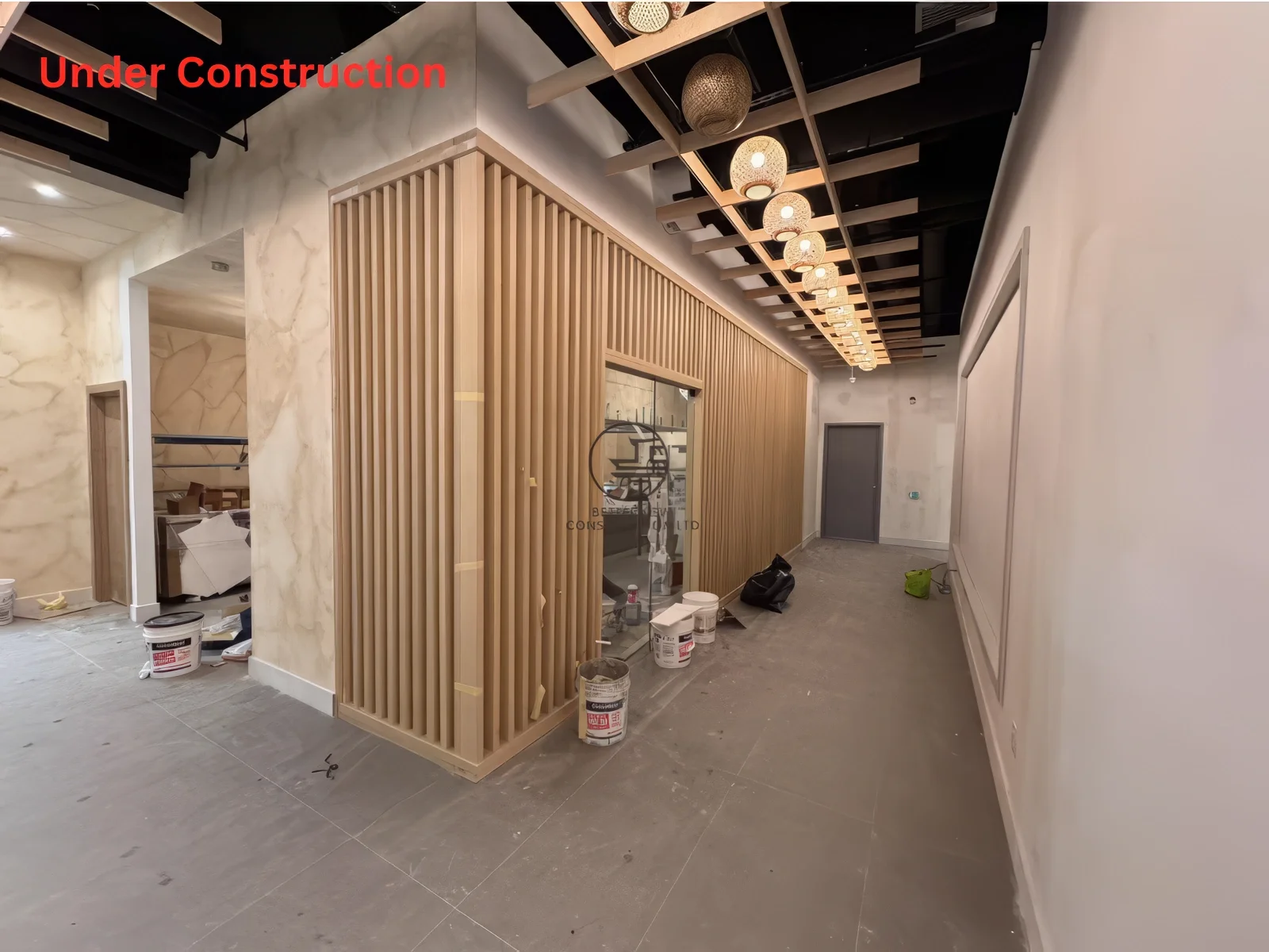 Restaurant renovation near completion in Toronto featuring bar counter layout, wood slat design, and modern Japanese interior build-out