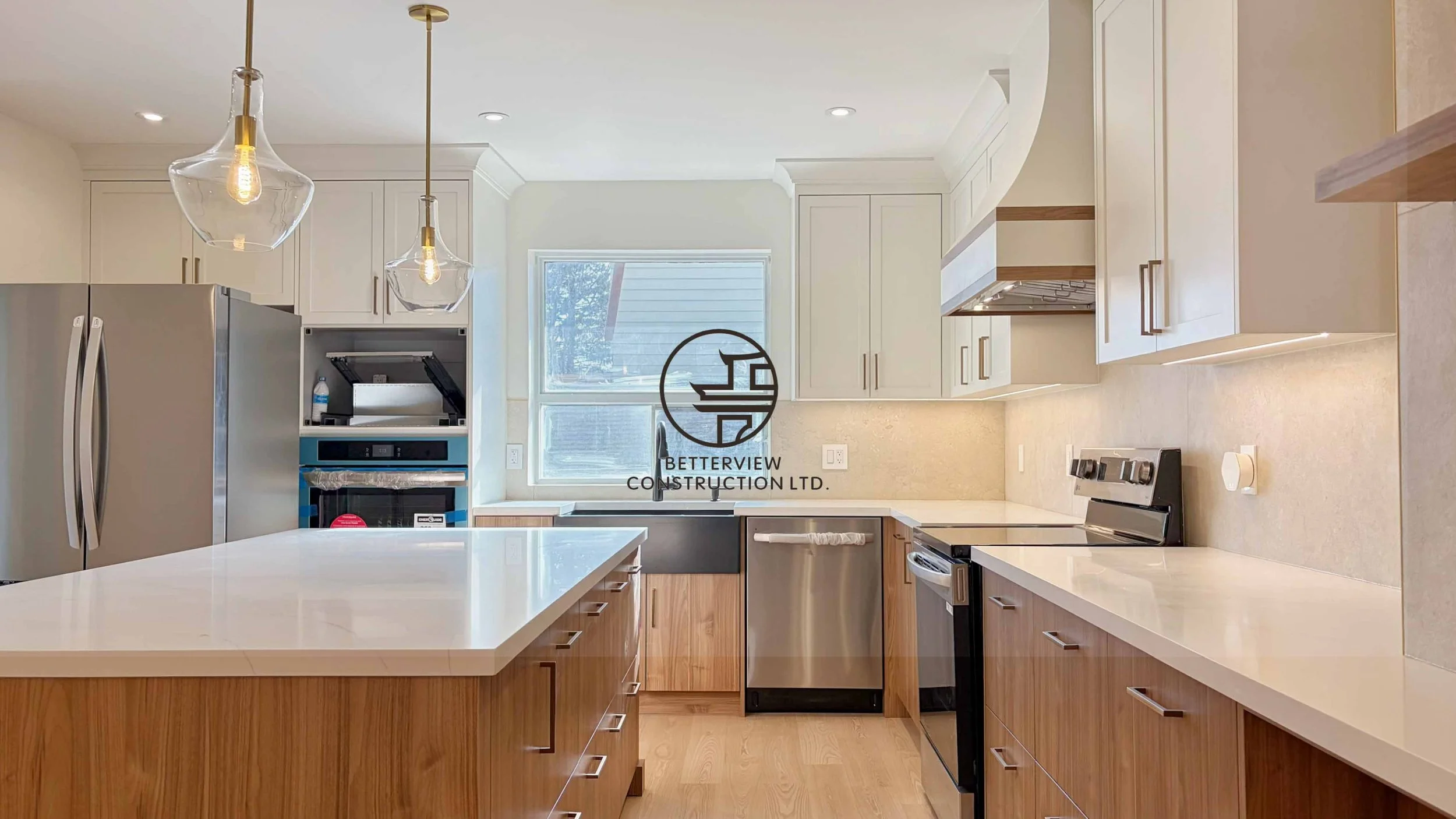 Modern open-concept living room and kitchen designed and built by Betterview Construction Ltd., featuring custom millwork and a clean contemporary interior design style, showcasing high-quality residential renovation, construction, and interior finis