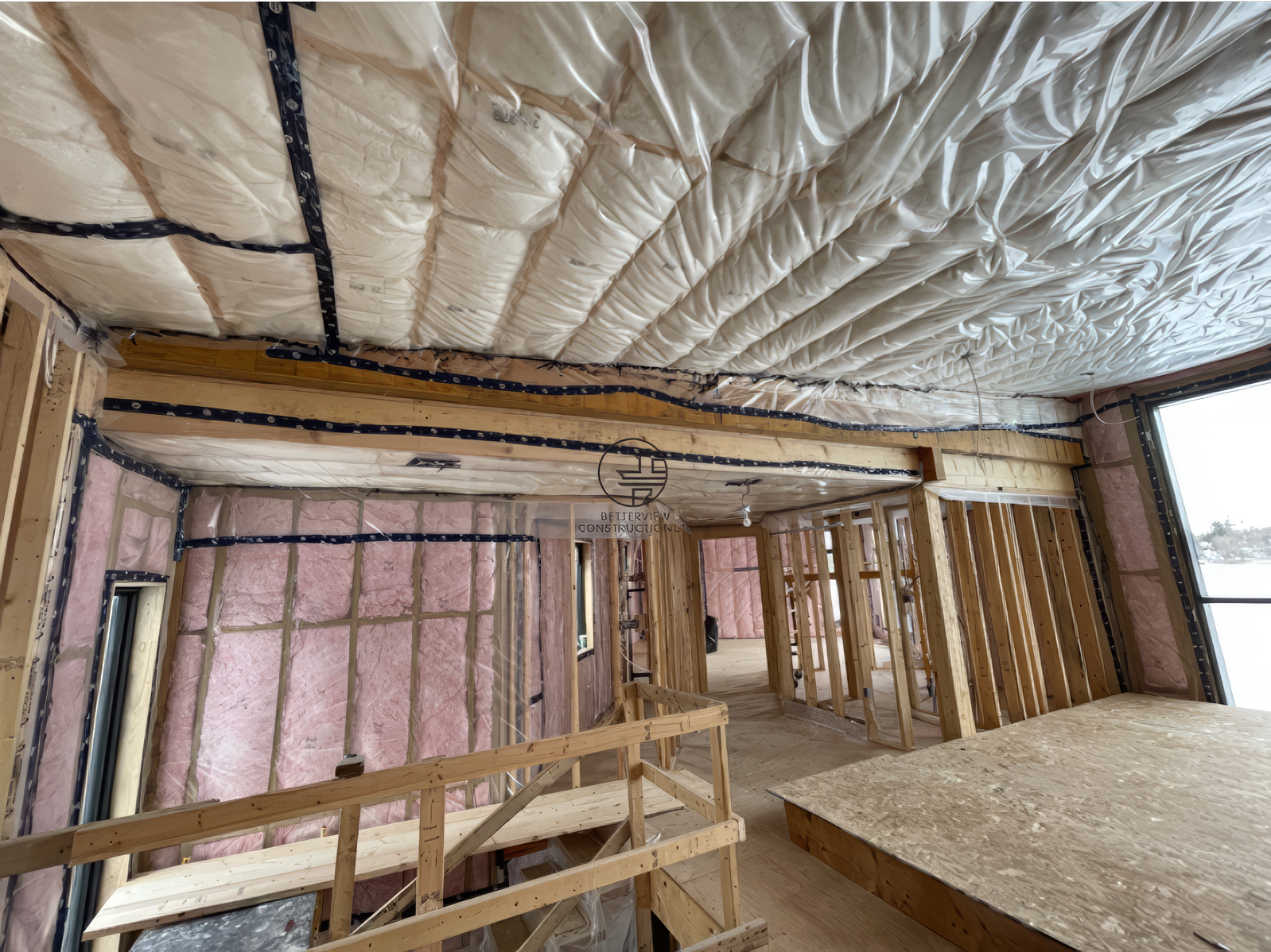 Interior home renovation with framing and spray foam insulation, exposed beams and open-concept layout