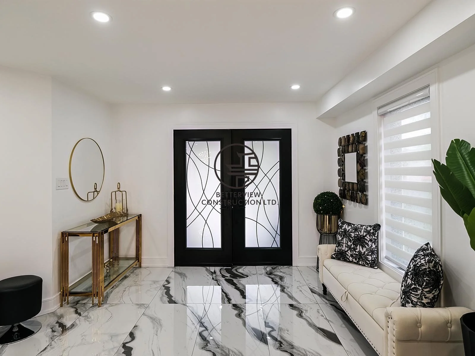 The spacious front foyer features double entry doors, marble-look porcelain flooring, and clean contemporary finishes, creating a bright and elegant first impression.