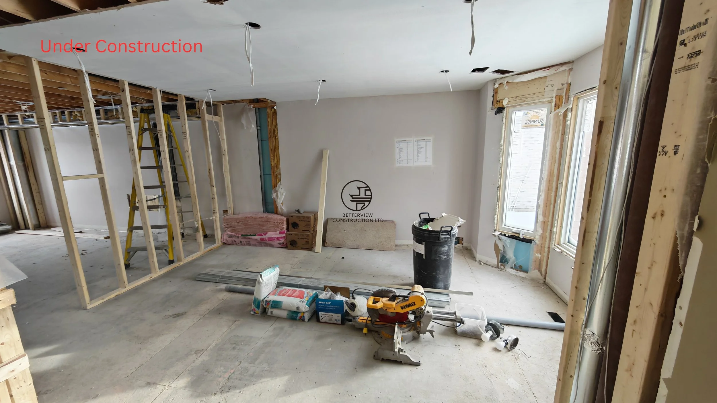 home renovation under construction with framing drywall installation exposed walls and construction tools in residential remodeling project